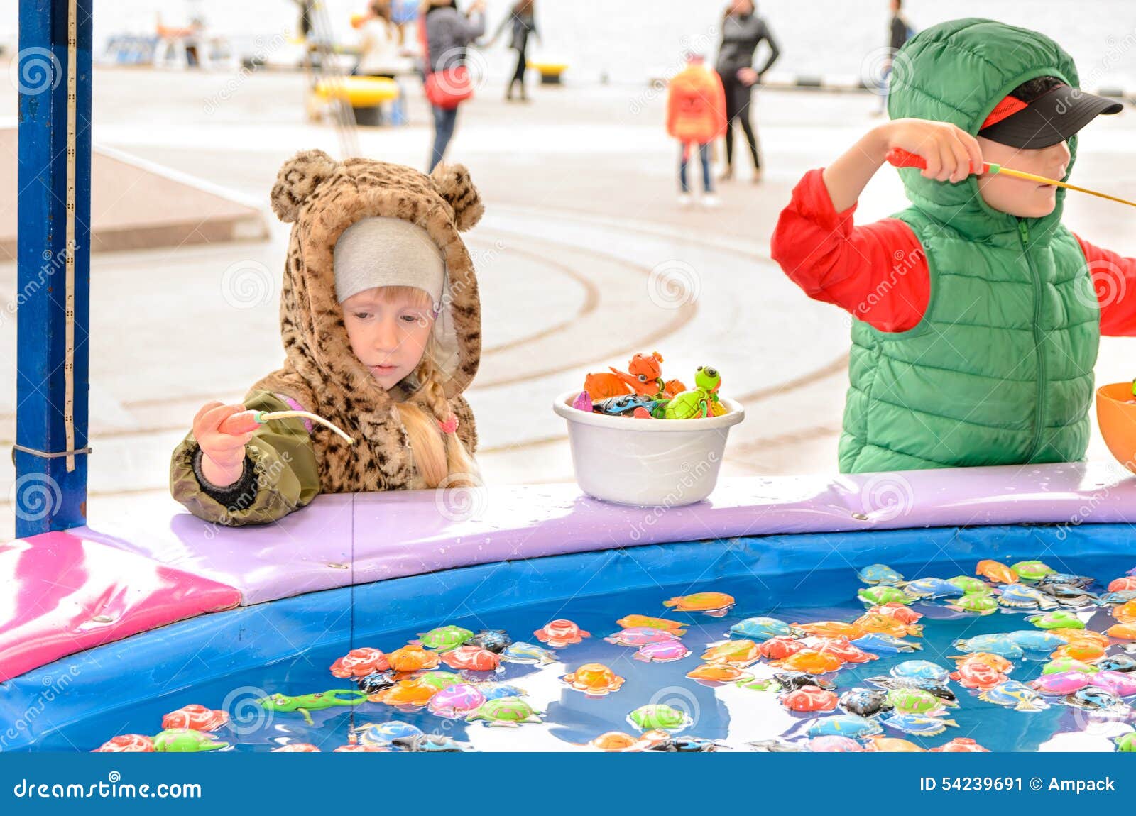 https://thumbs.dreamstime.com/z/children-playing-fishing-pond-game-fun-fair-wearing-warm-clothing-amusement-outdoor-carnival-54239691.jpg