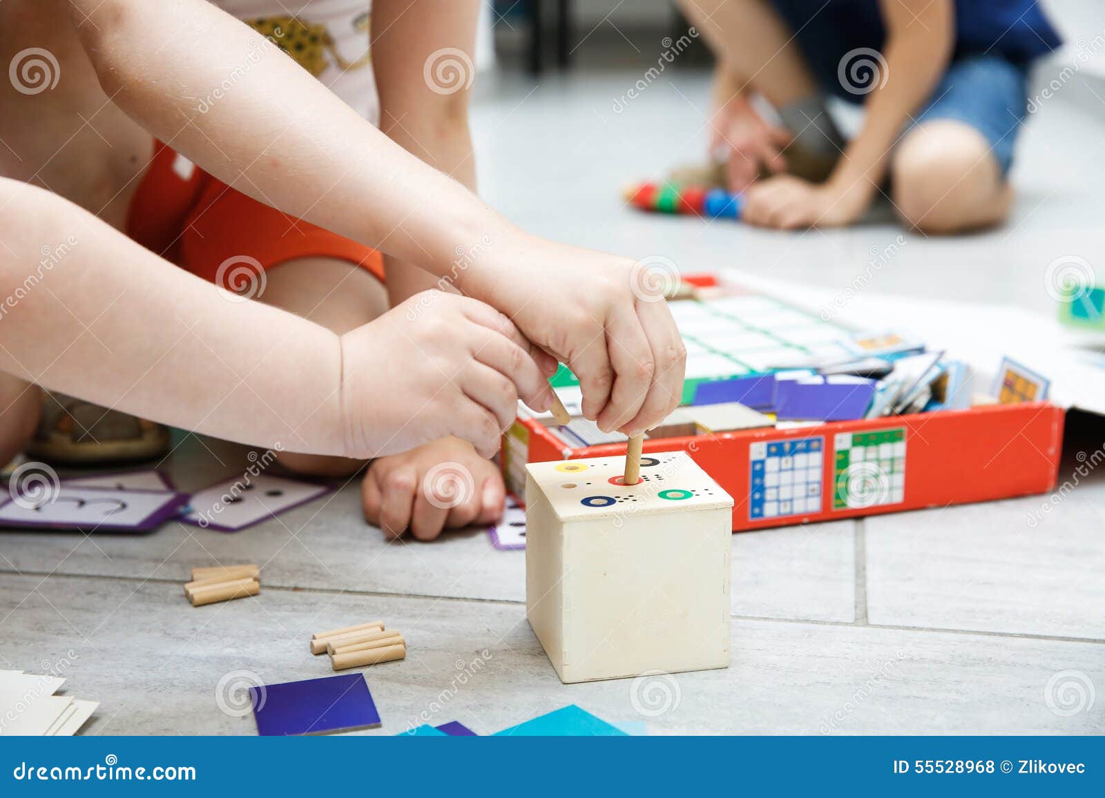 children playing with homemade educational toys