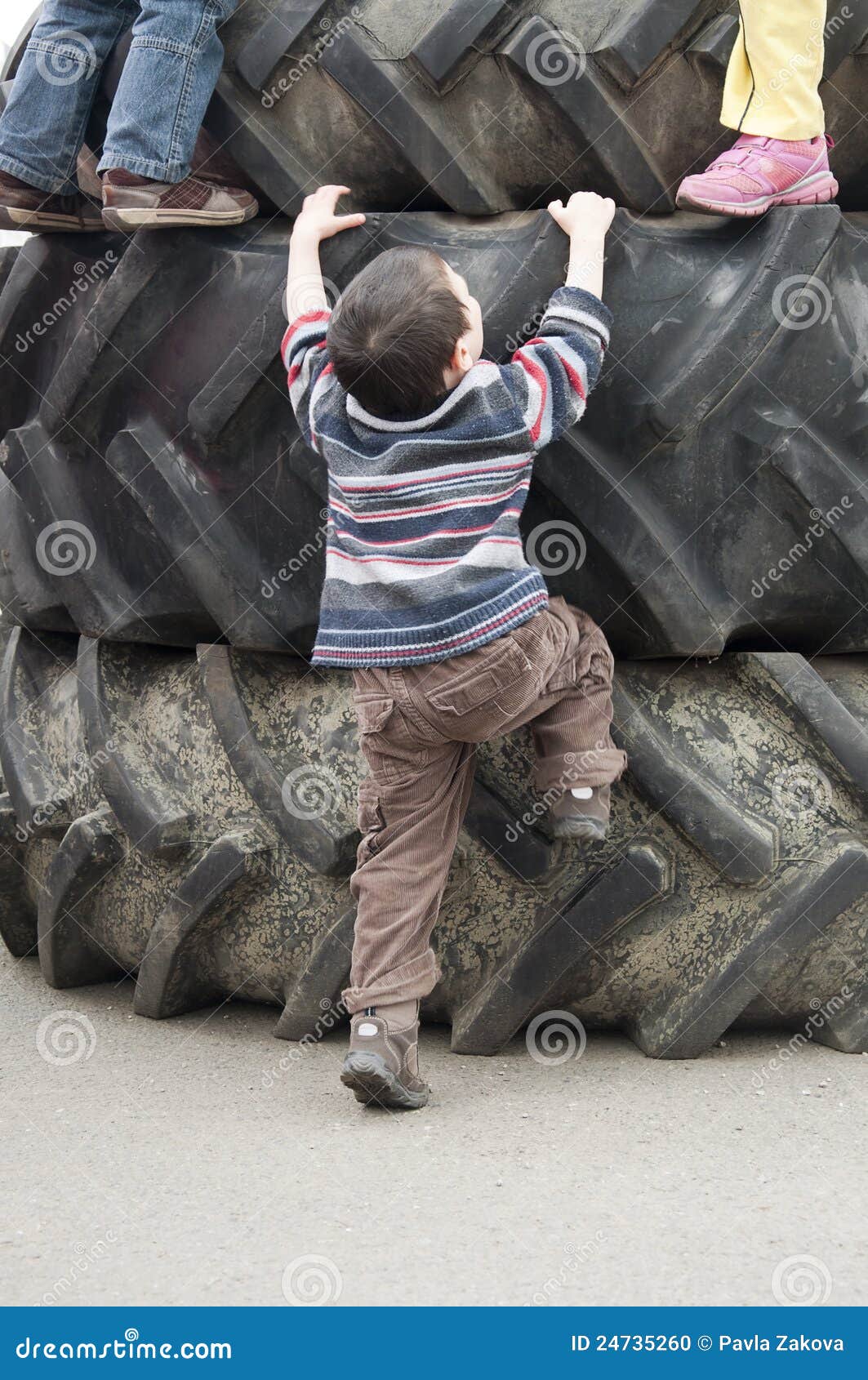 Children Playing On Tires Stock Photo Image 24735260