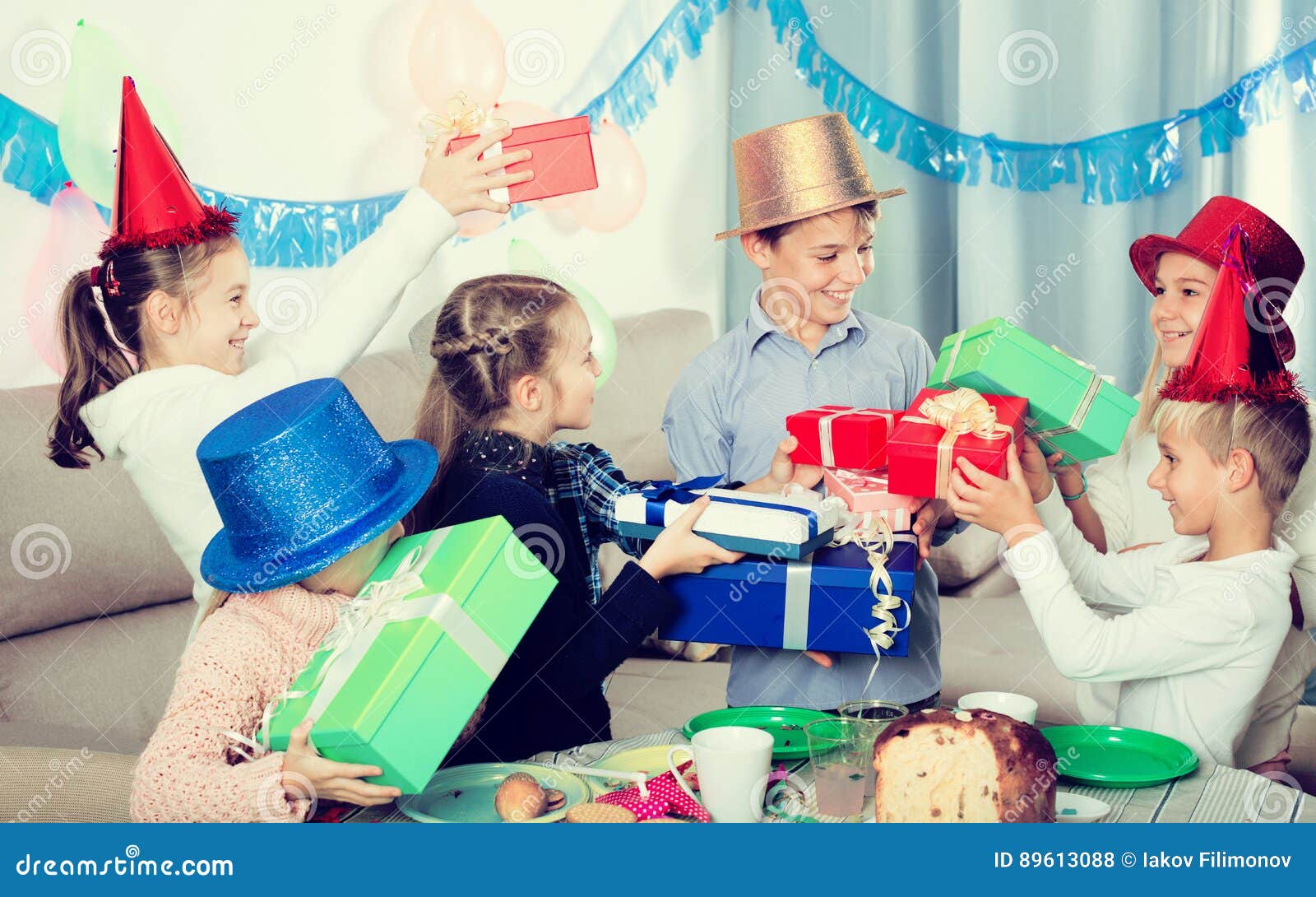 Children Presenting Gifts To Boy Stock Photo - Image of male, large ...
