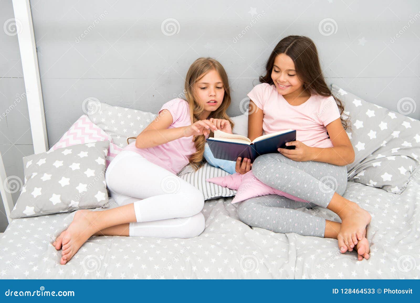 Children Read Book In Bed. Family Tradition. Girls Best Friends Read