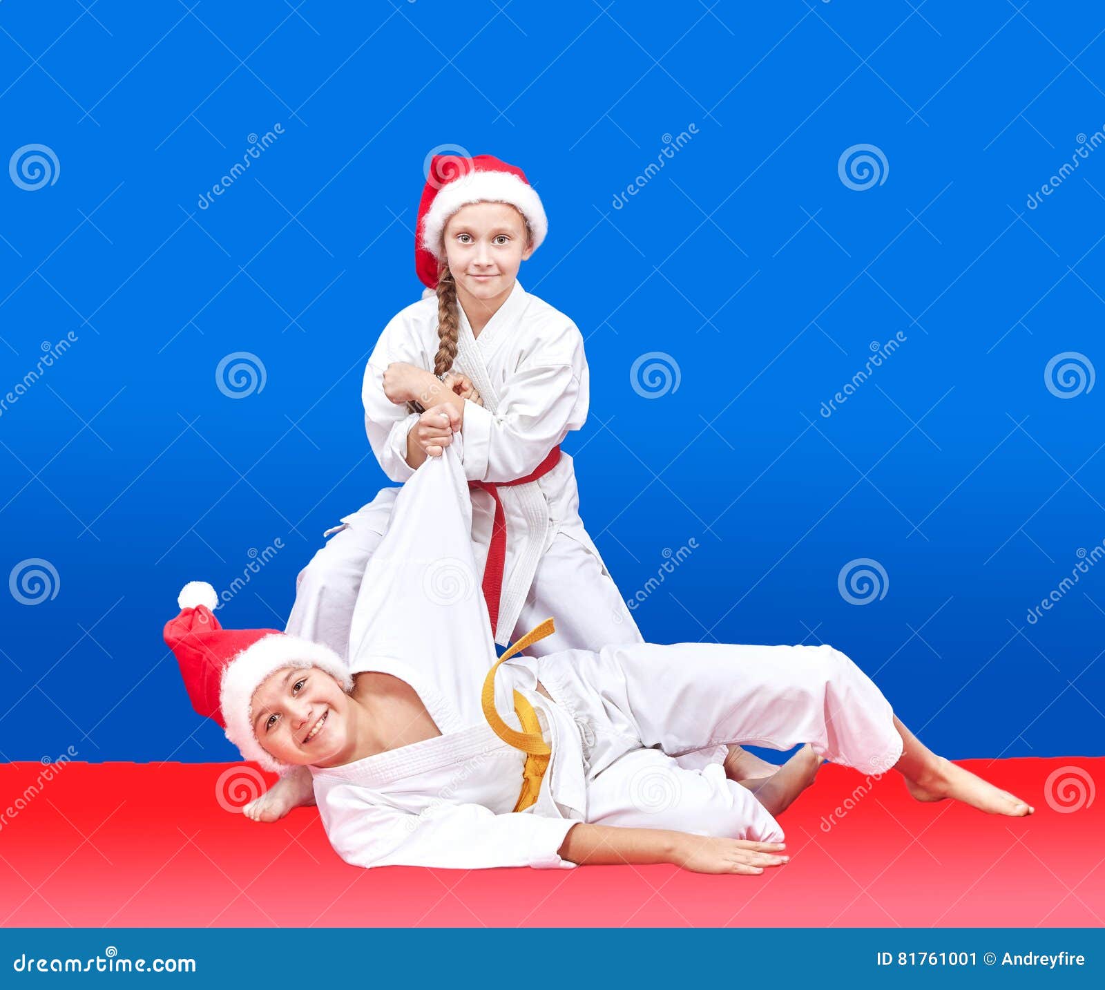 Children with Red and Yellow Belt are Training Throws Stock Image