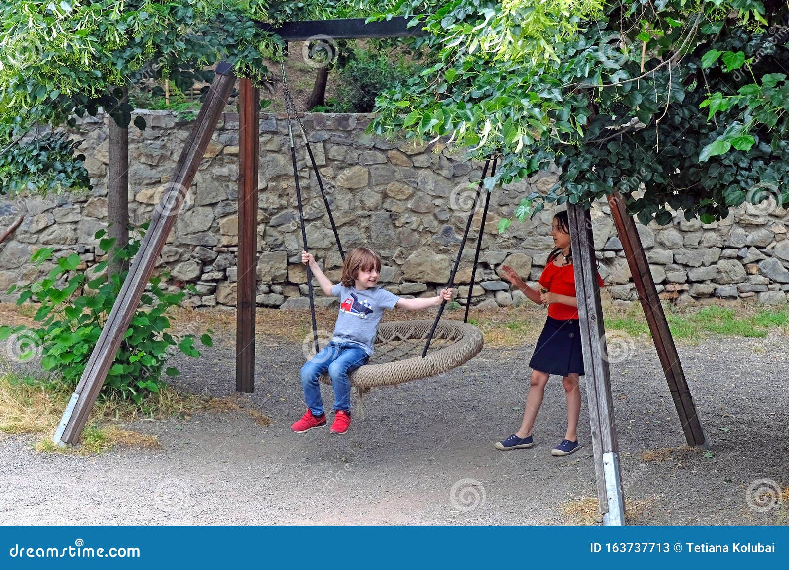 https://thumbs.dreamstime.com/z/children-ride-round-swing-net-park-tbilisi-georgia-june-girl-rolls-little-boy-botanical-garden-163737713.jpg
