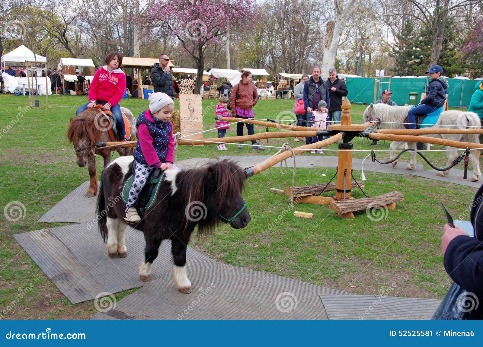 children-riding-ponies-pony-hourses-city-park-budapest-hungary-52525581.jpg