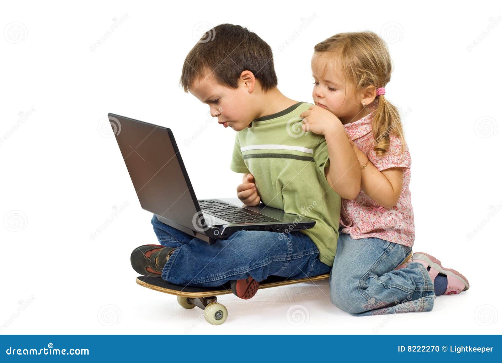 children rival for using the laptop