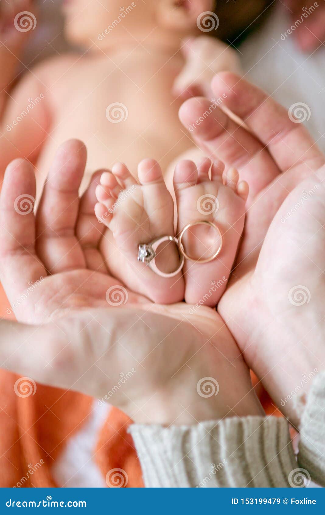 Children`s Feet in Hands of Mother and Father. Mother, Father and ...