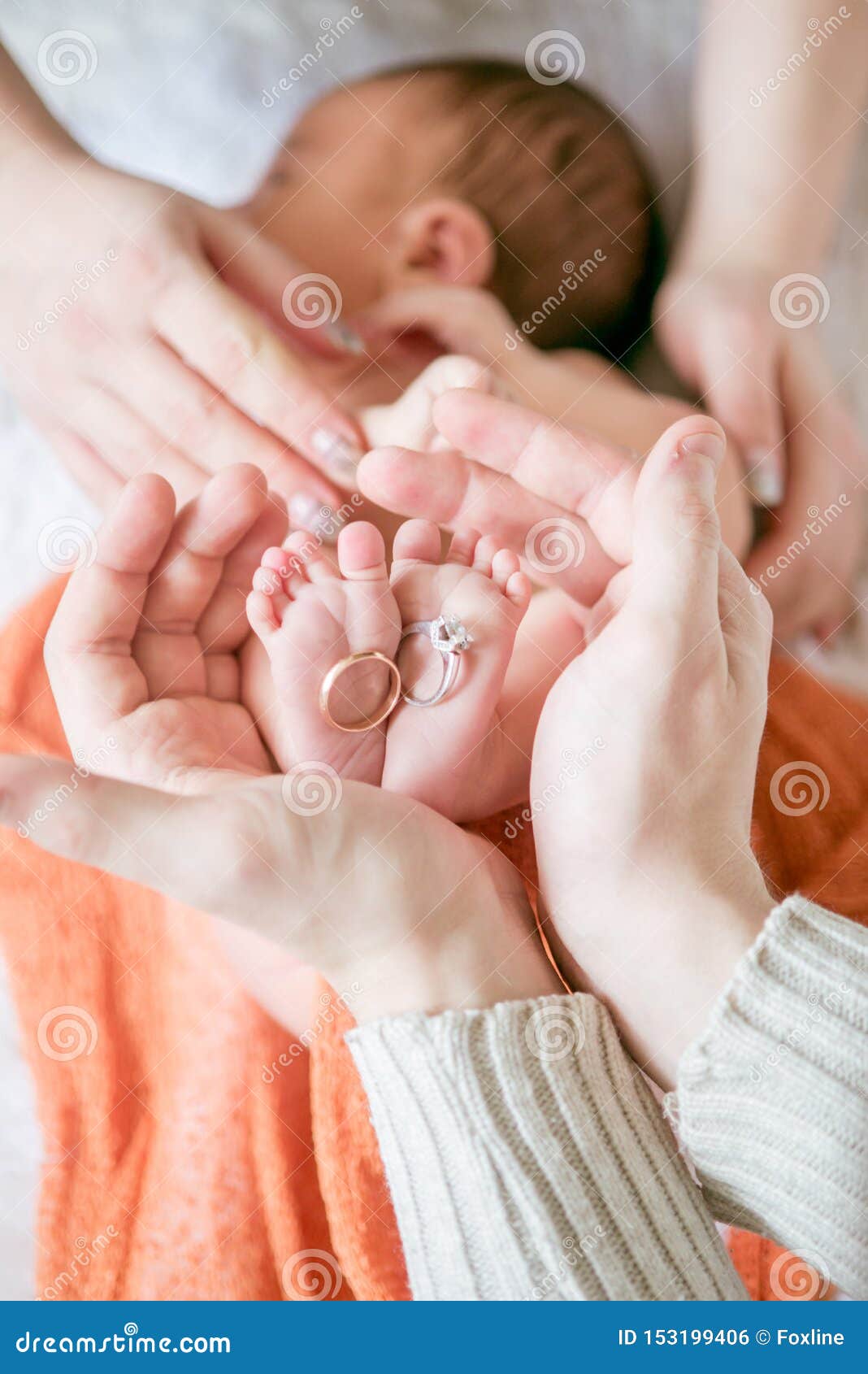 Children`s Feet in Hands of Mother and Father. Mother, Father and ...