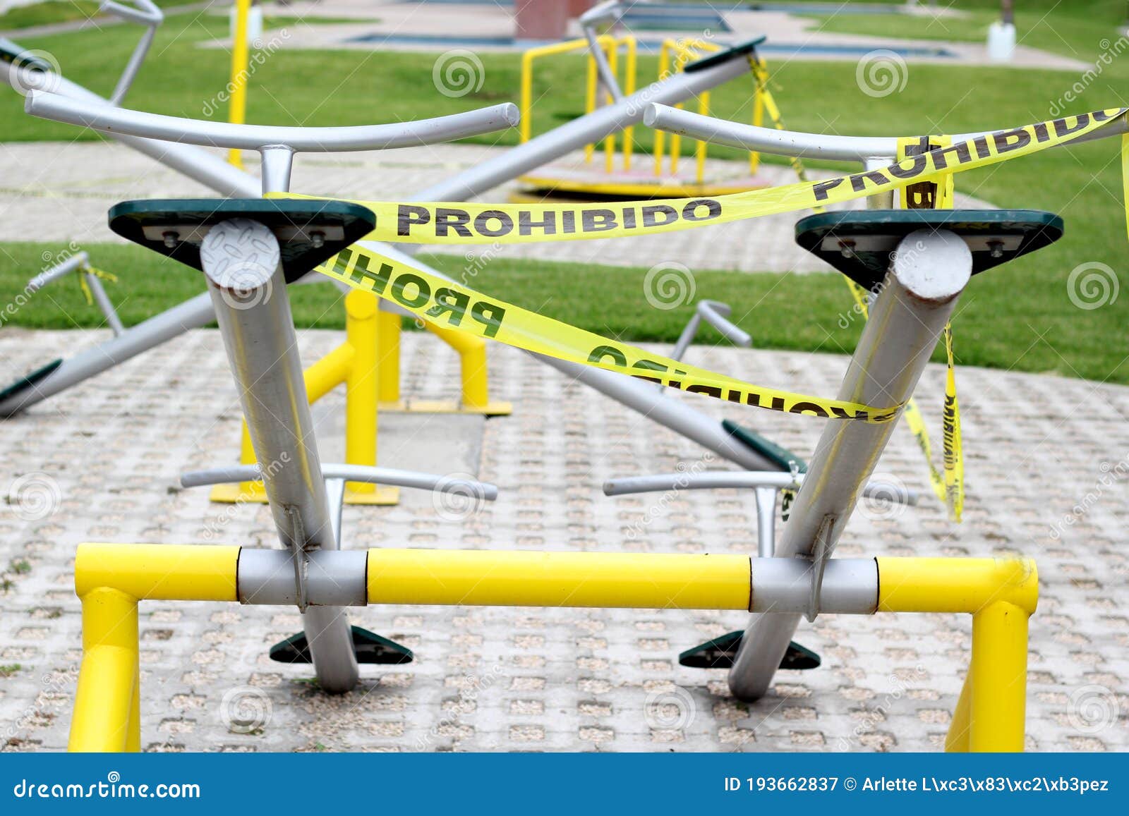 children`s games cordoned off with yellow tape `forbidden` due to covid-19 health contingency, new normal