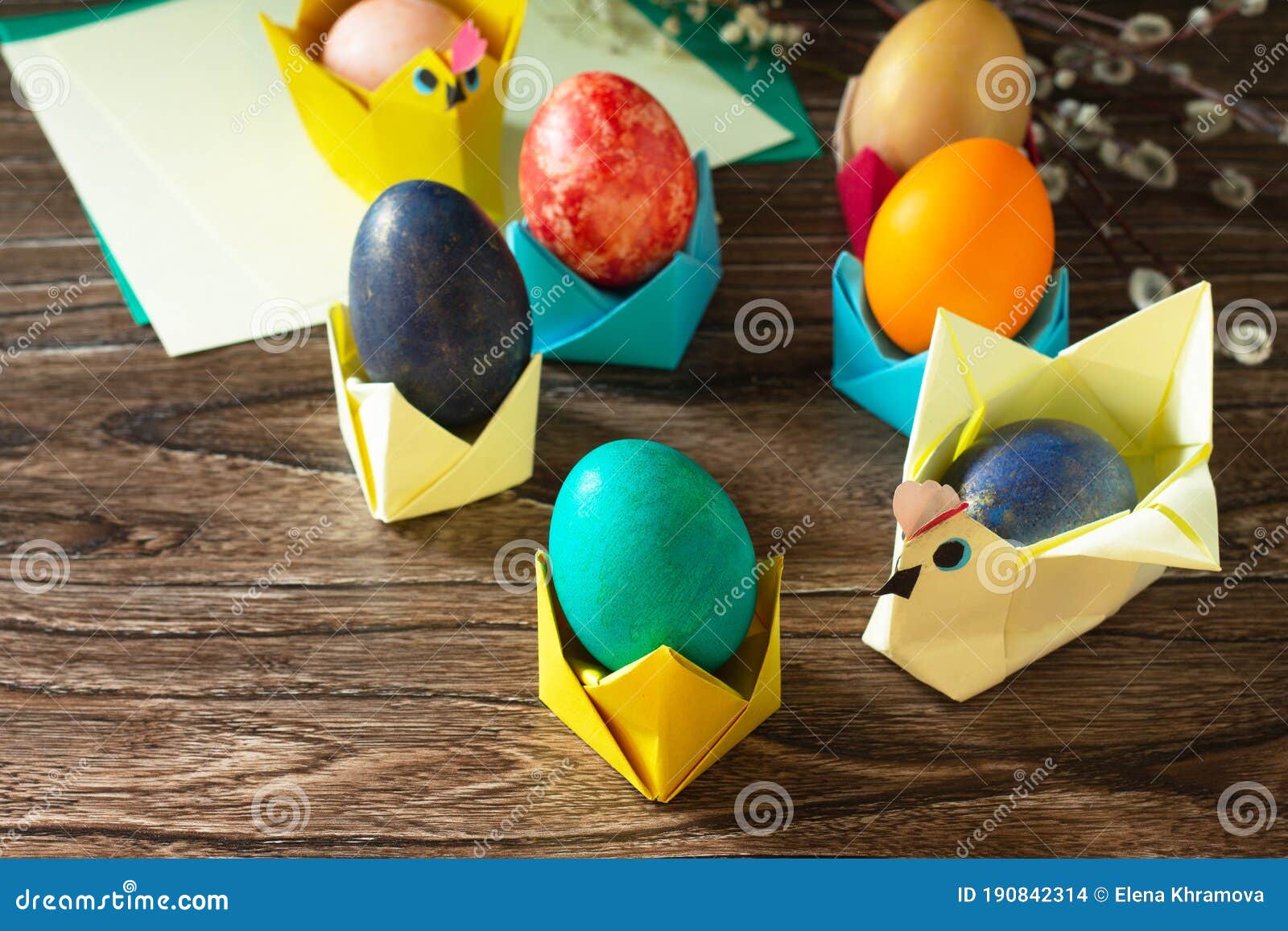 Childrens Gift Easter Egg Wrapping on a Wooden Table. Handmade Stock