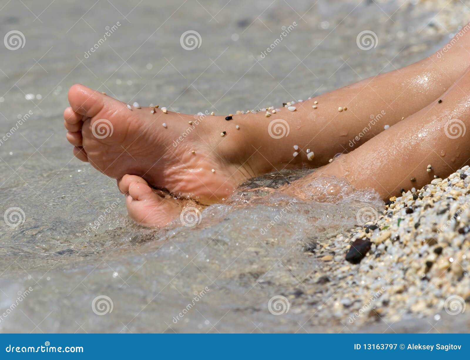 Children s legs stock image. Image of child, ocean, stone 13163797