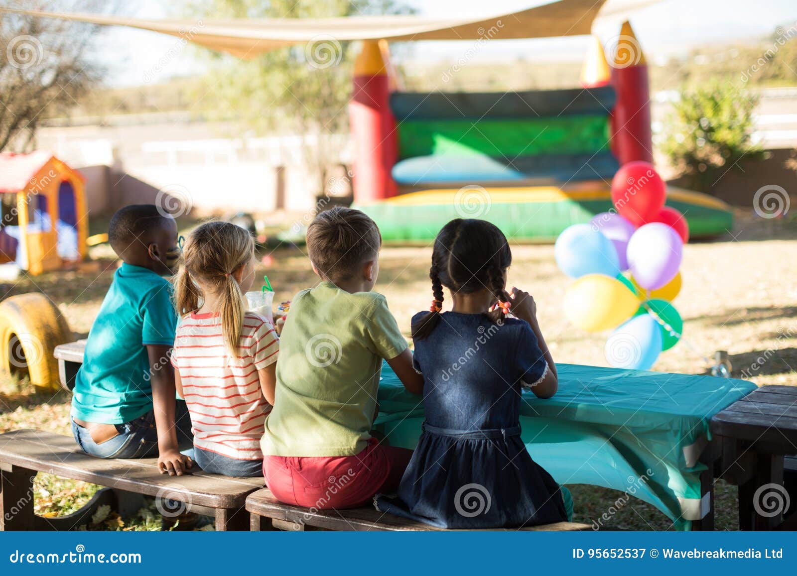 Children Sitting on Bench at Park Stock Image Image of park, male