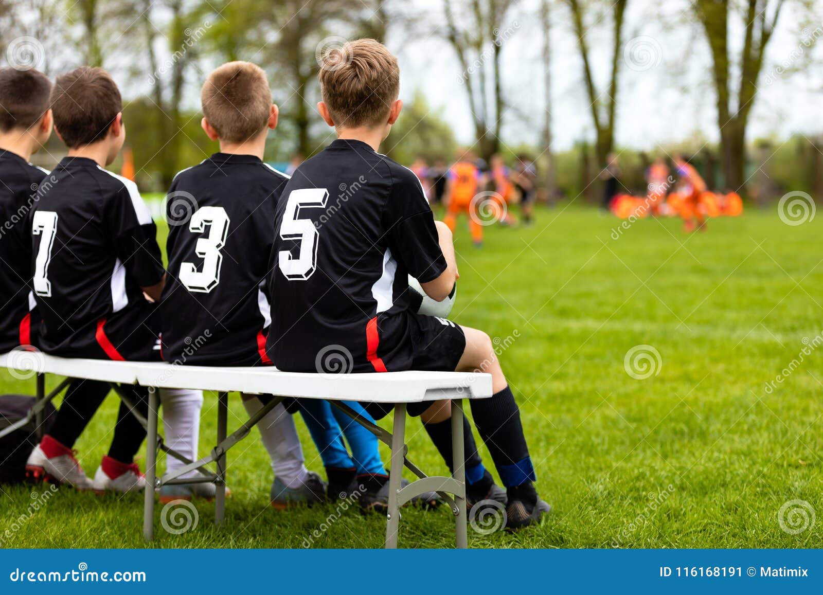 Children Soccer Team On A Bench Young Football Team Players