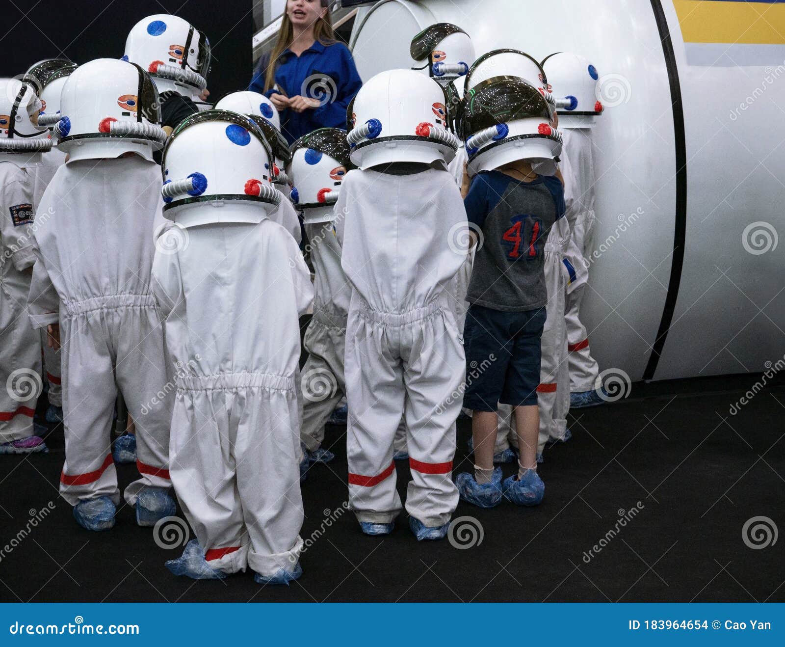 Children in a Suit of Astronauts Looking Astronaut Space in Museum