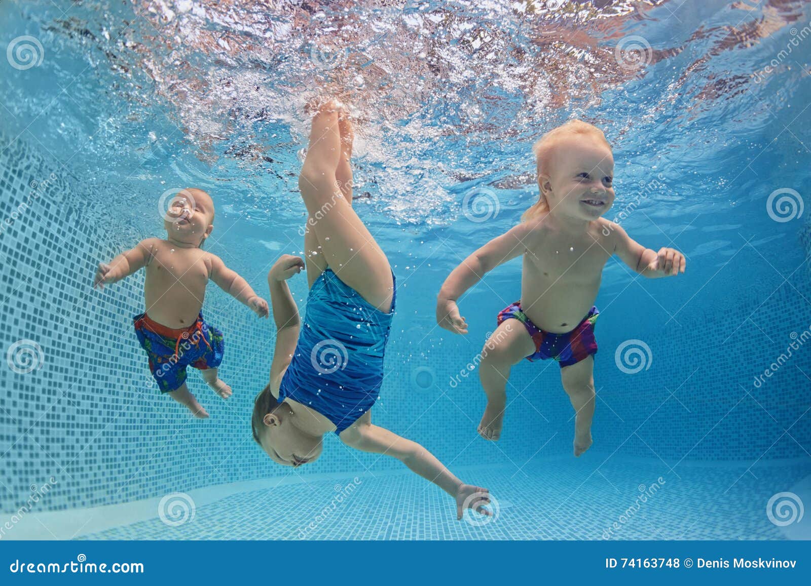 Children Swim Underwater