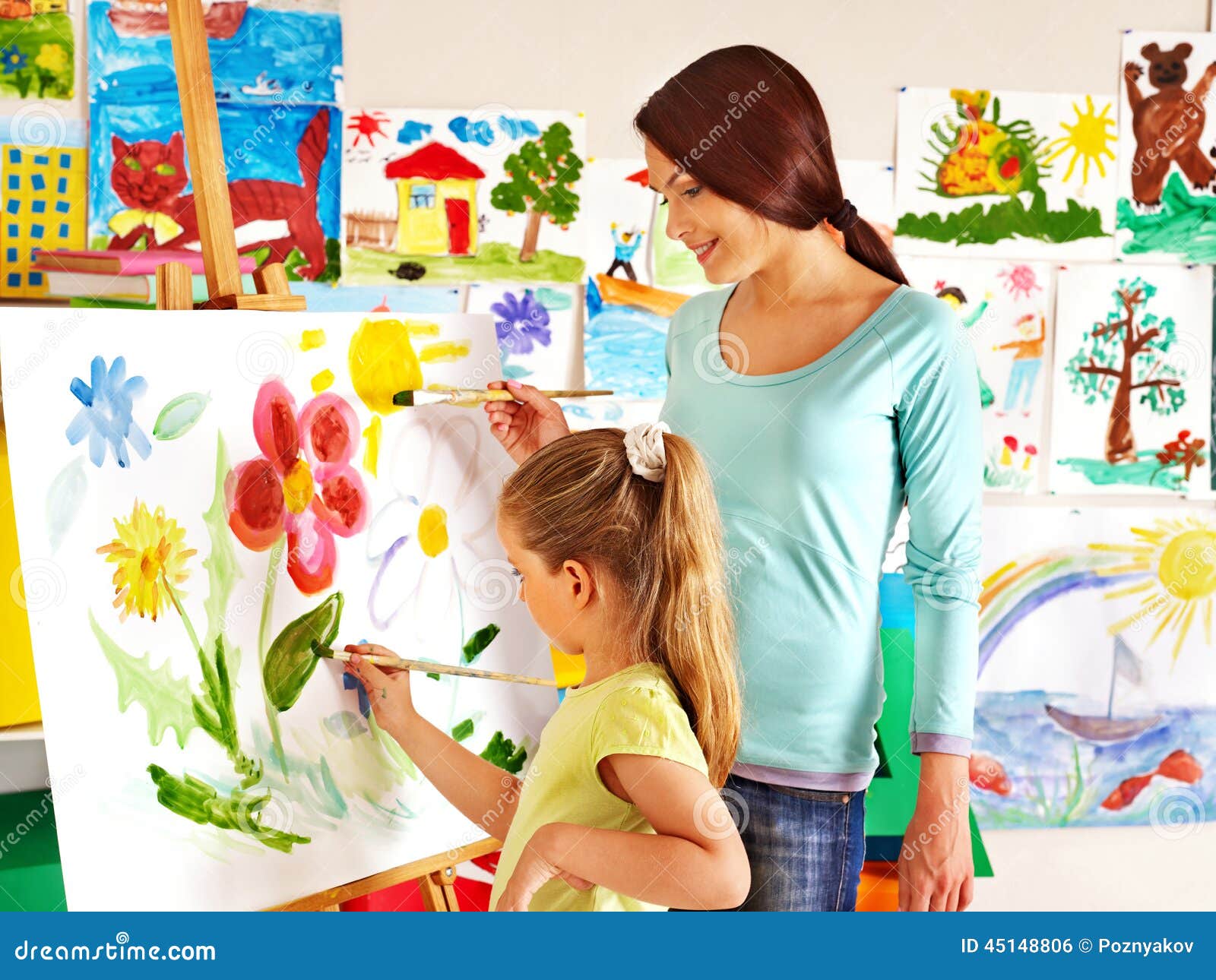 Children with Teacher Painting. Stock Photo Image of group