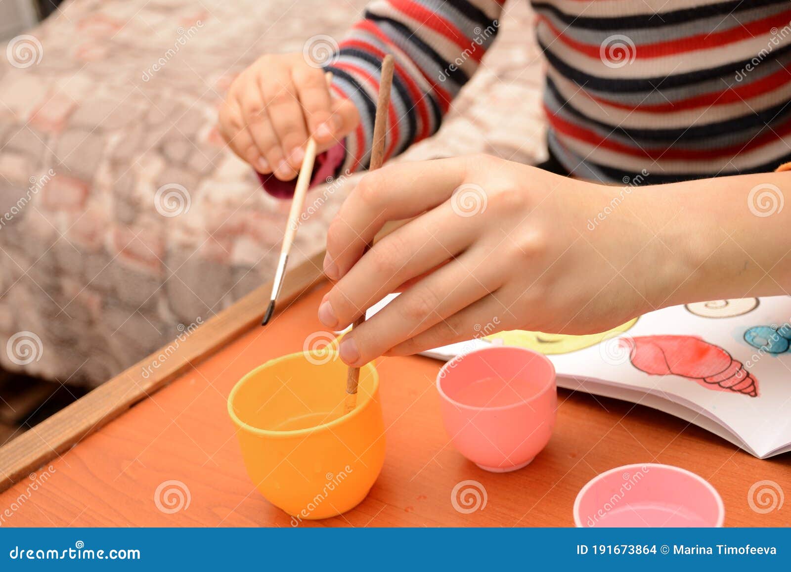 Children Wash Off Paint from a Brush. Drawing and Child Development