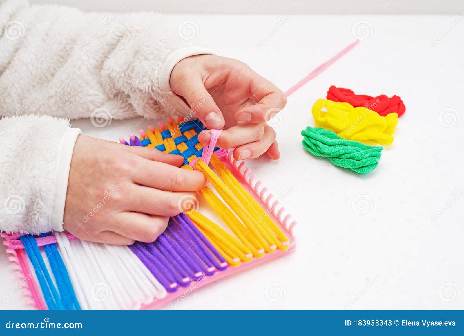 Childrens Creativity Weaving with Colored Threads Ropes Stock Image