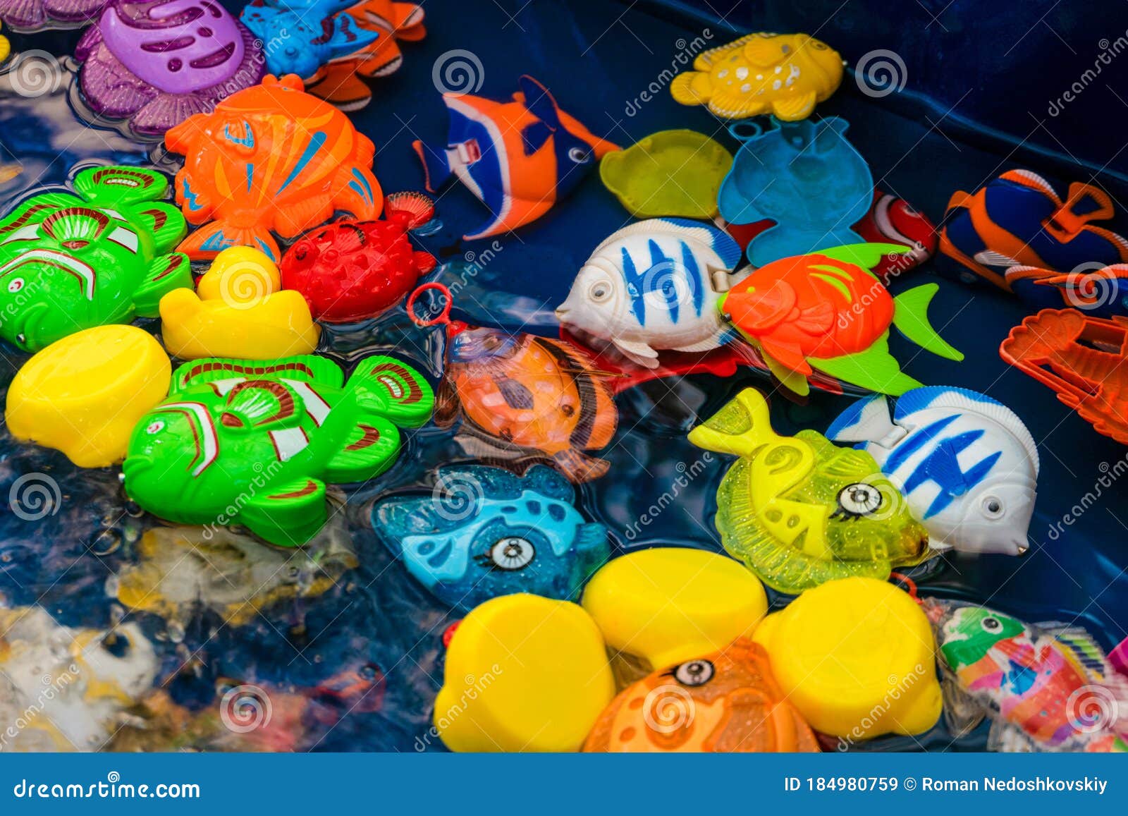 Childrens Plastic Colorful Fish Toys in the Pool for Playing in the Fishing  Stock Image - Image of funfair, outdoors: 184980759