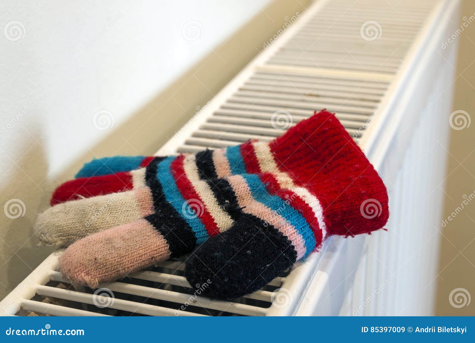 Childs Knitted Gloves Drying on Heating Radiator after Winter Da Stock ...