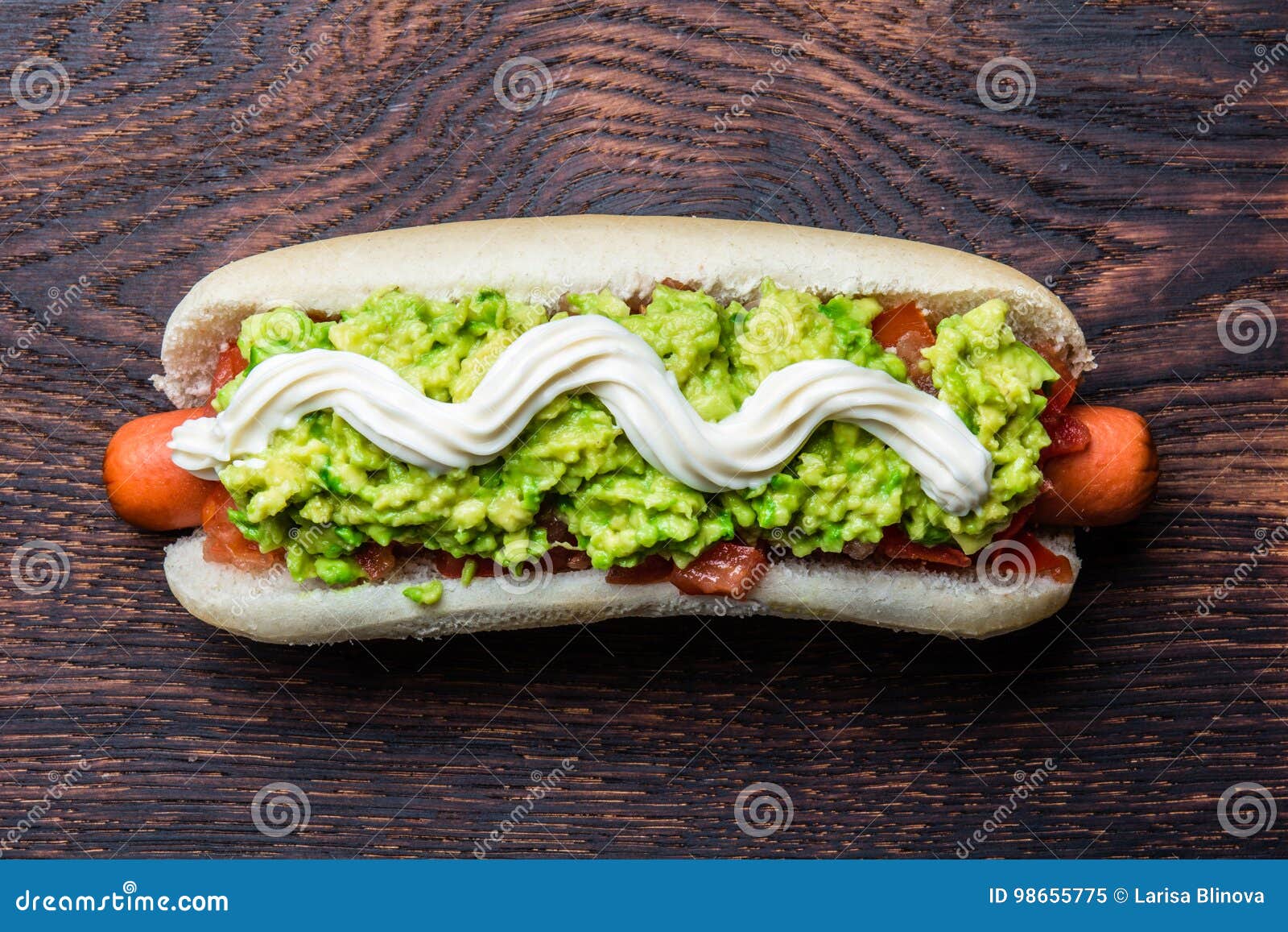 chilean completo italiano. hot dog sandwiches with tomato, avocado and mayonnaise on wooden board. top view, copy space