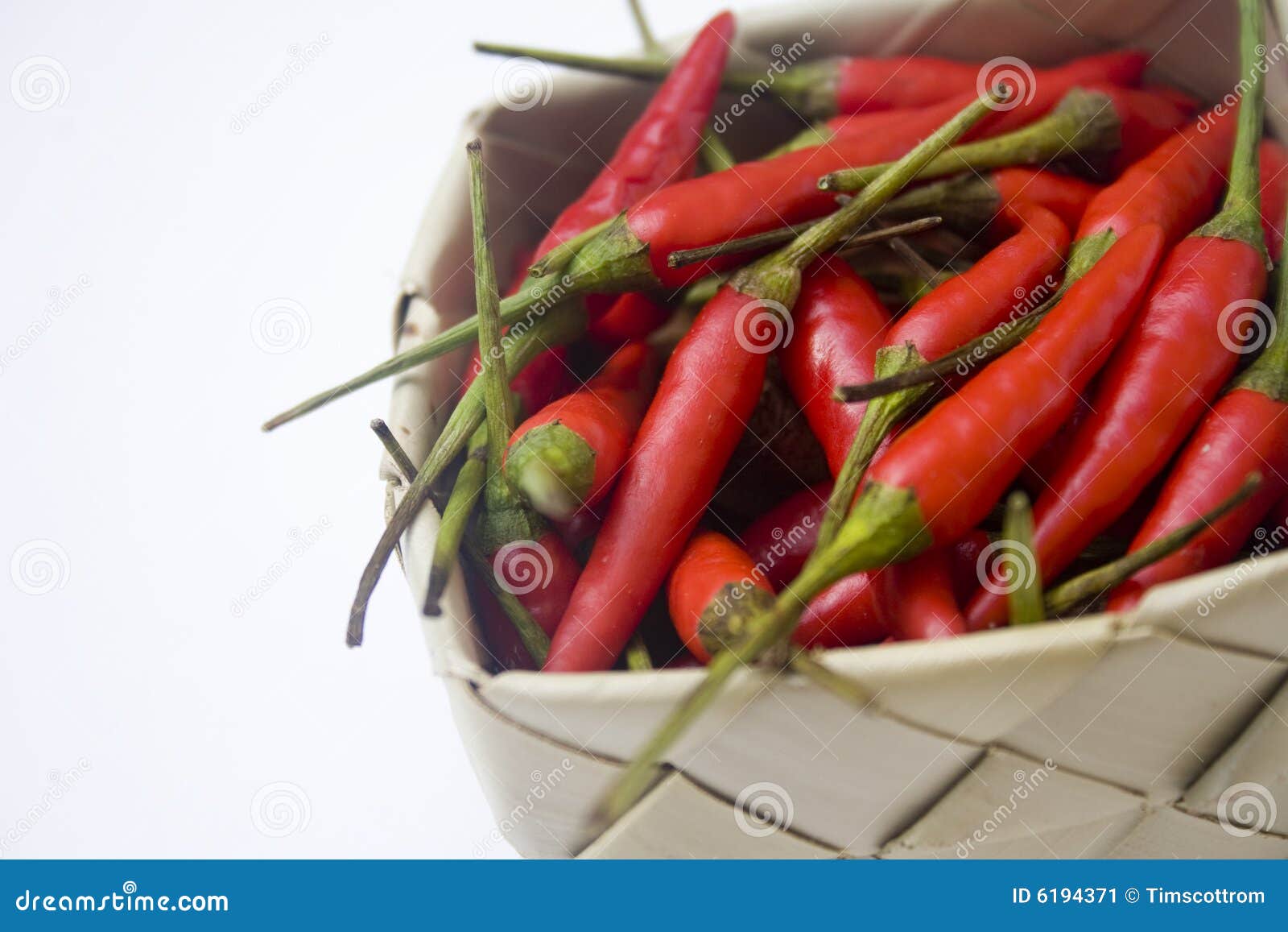 Chili peppers in basket stock image. Image of burning 6194371