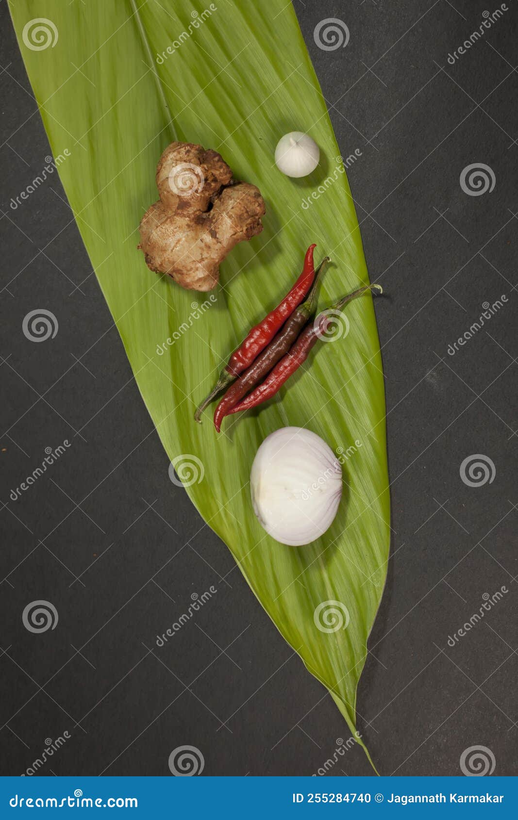 Chilli Onion Garlic Ginger is Placed on a Turmeric Leaf Stock Photo