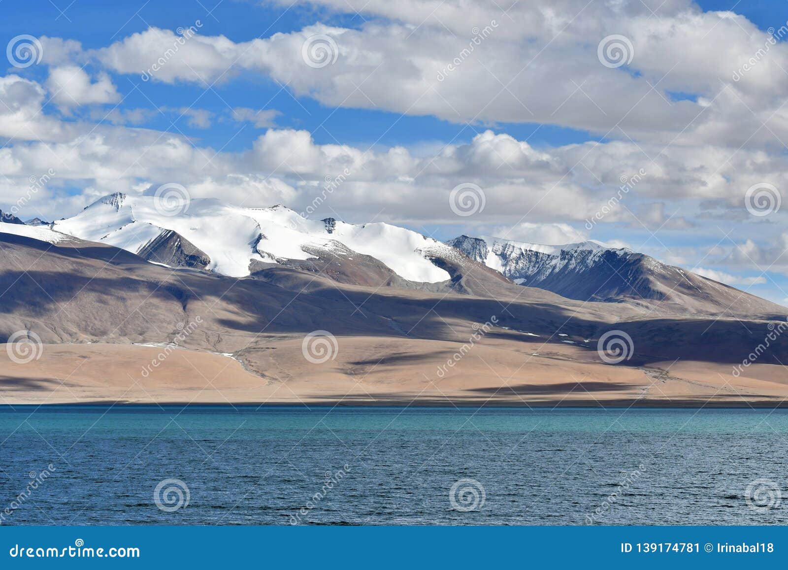china, tibet. clouds above lake chovo co 4765 m, located at the foot of the snowy mountains of koding kangri 6666 m