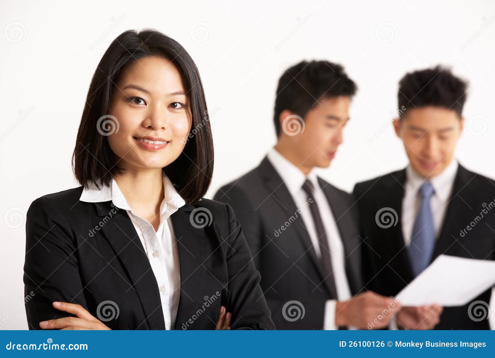 Chinese Businesspeople Discussing Document Stock Photo Image of