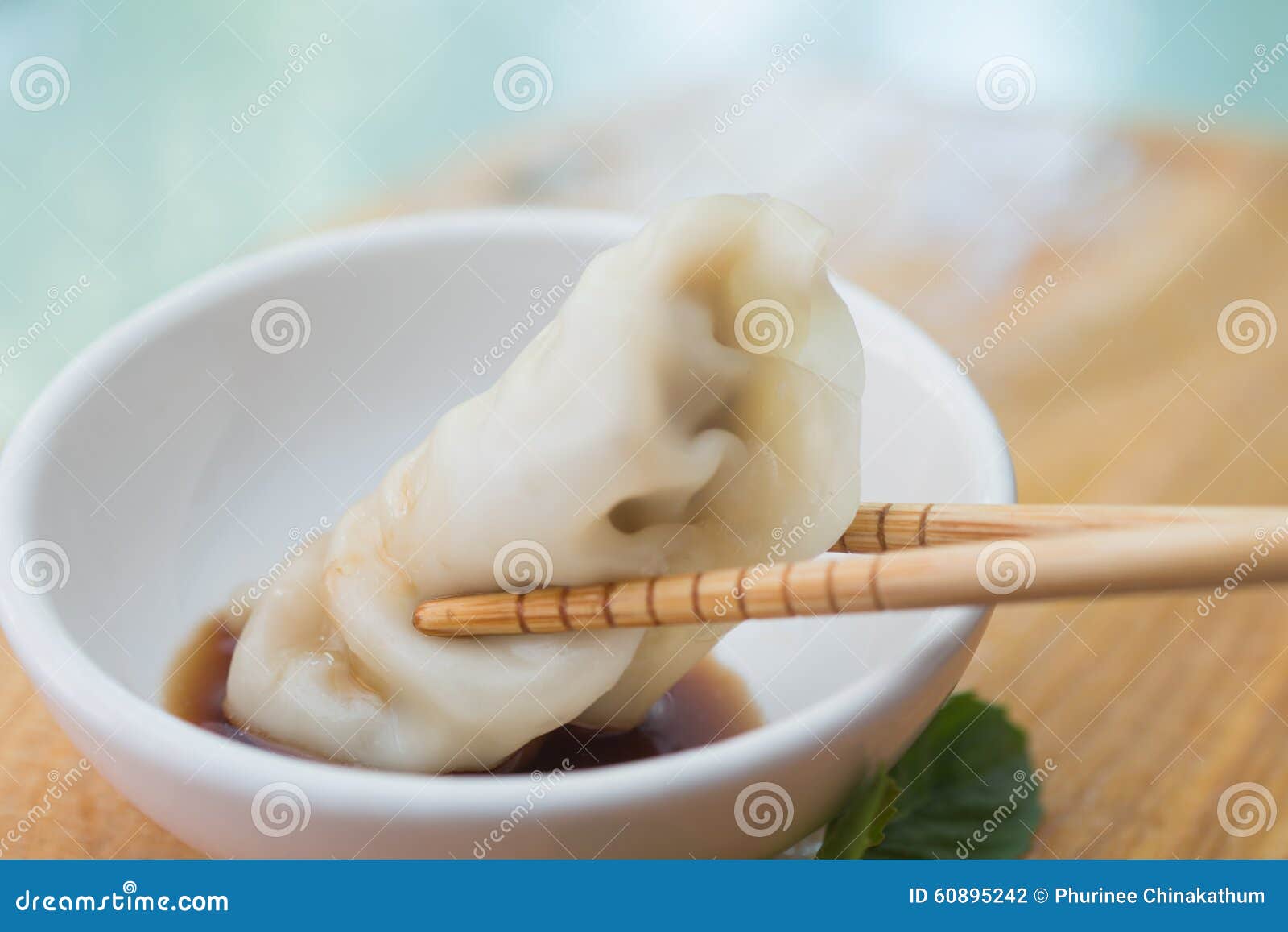 chinese dumplings or jiaozi with chopstick