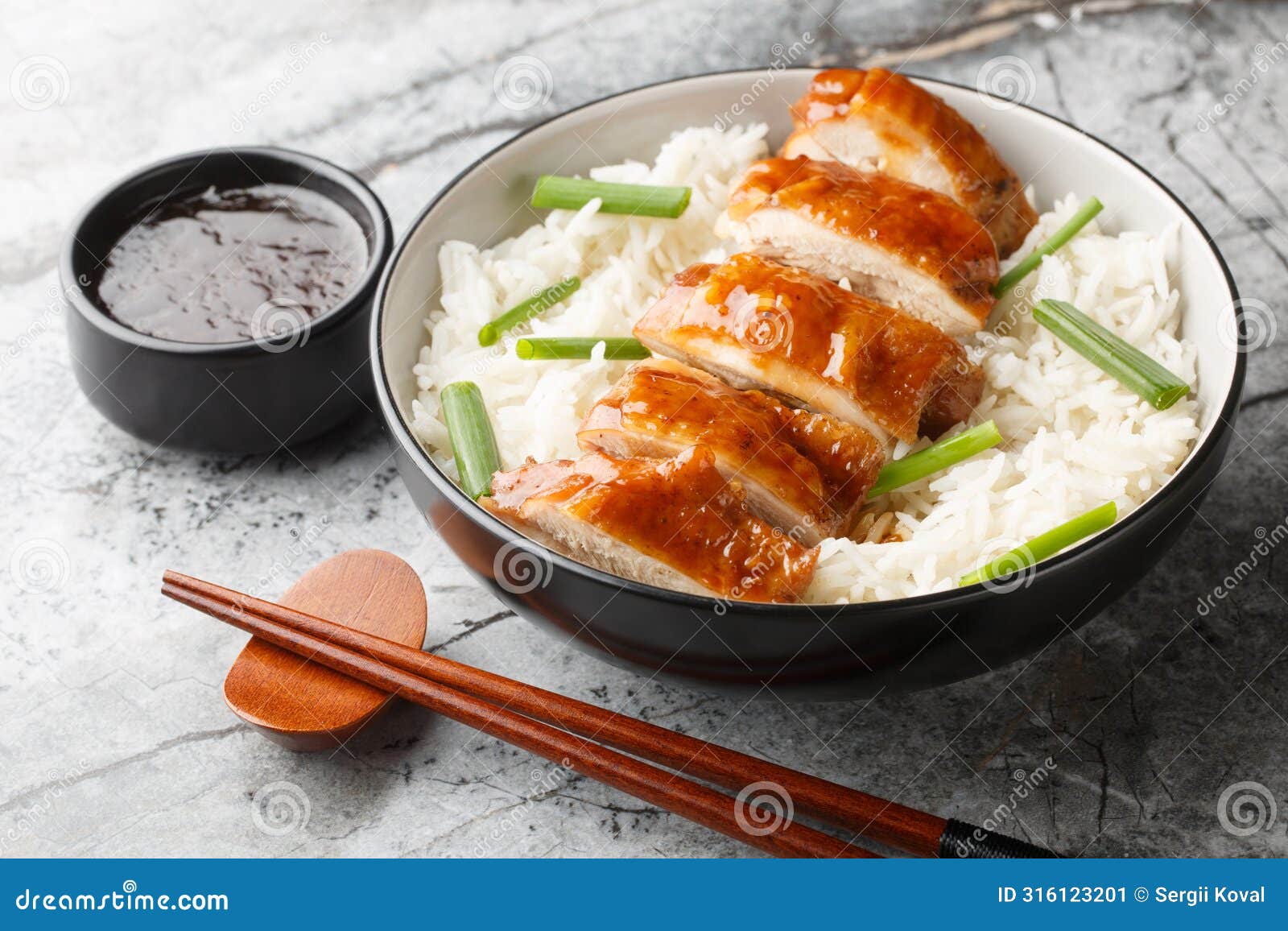chinese food soy sauce chicken or see yao gai served with rice and dipping sauce closeup. horizontal