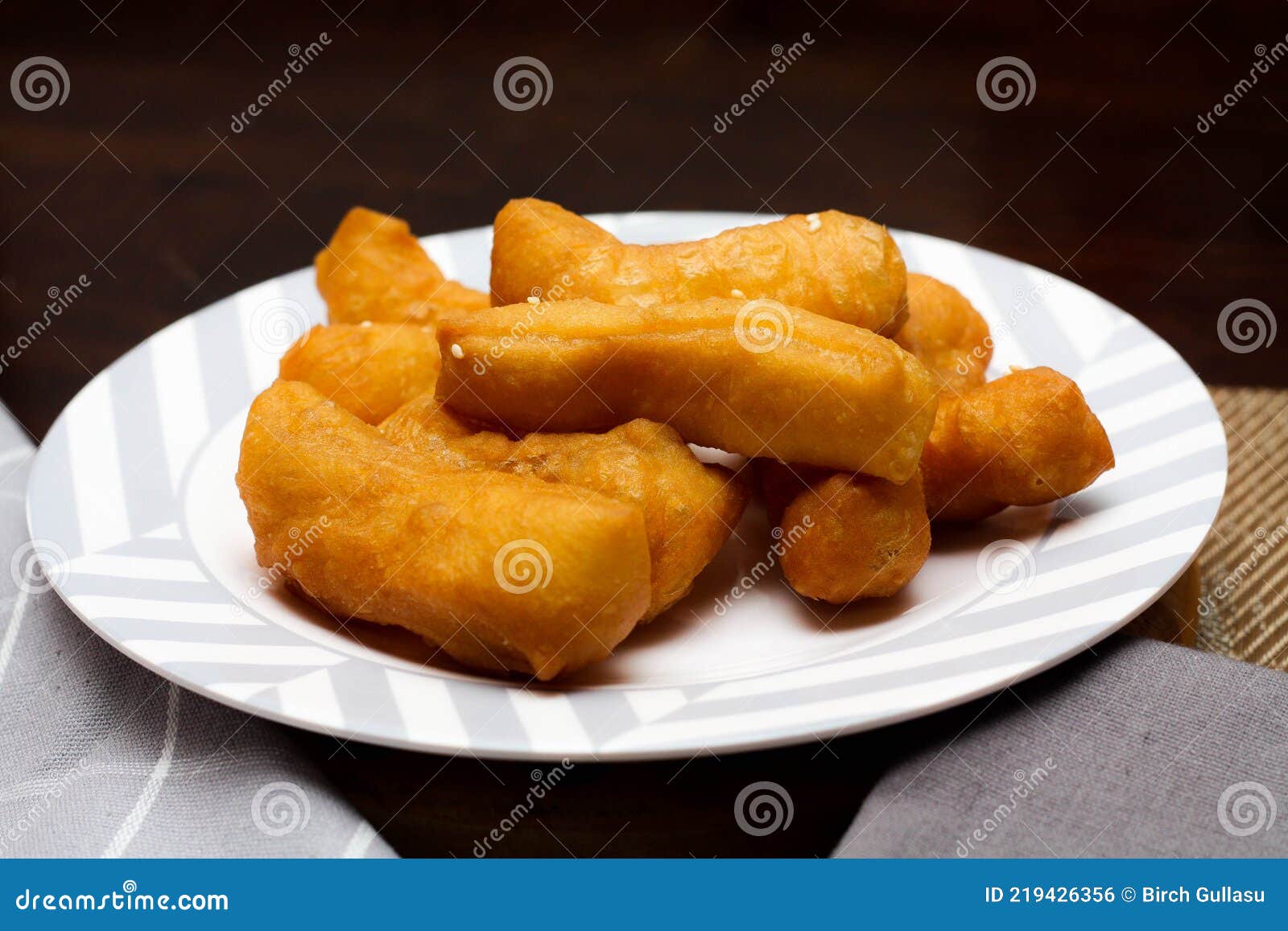 chinese fried dough or deep-fried dough stick or doughnut or fried bread stick.