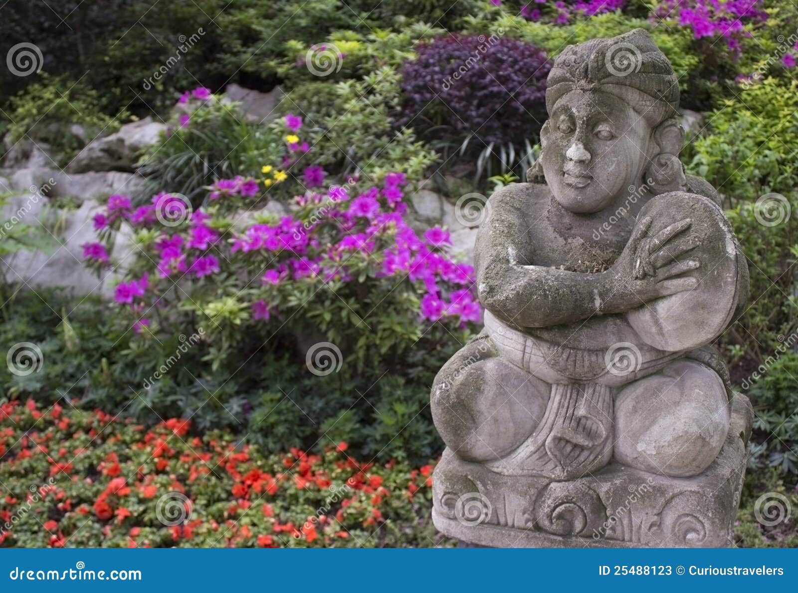 Chinese Garden Statue in Front of Flowers Stock Image Image of
