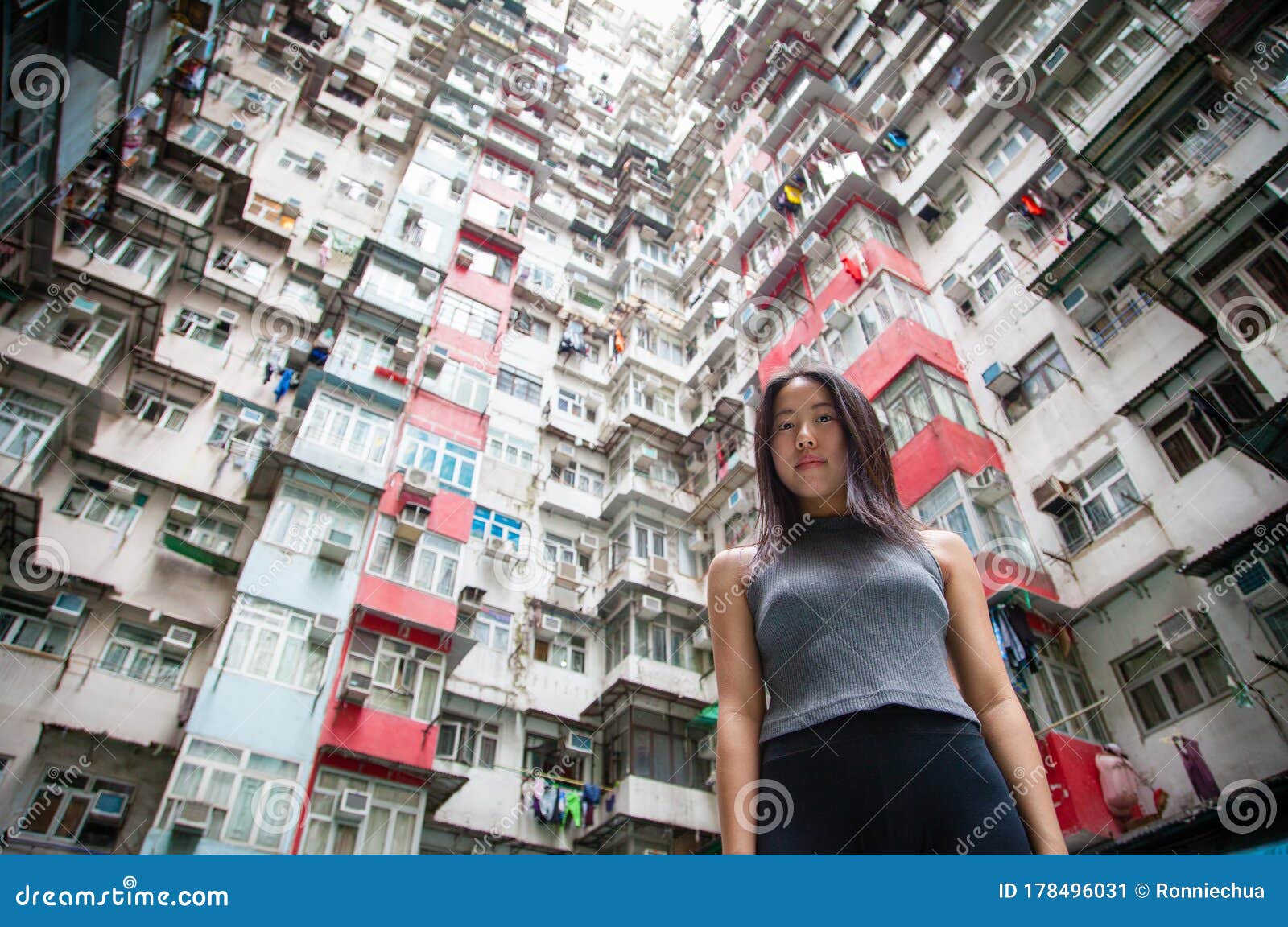 traveler exploring densely populated housing apartments in hong kong