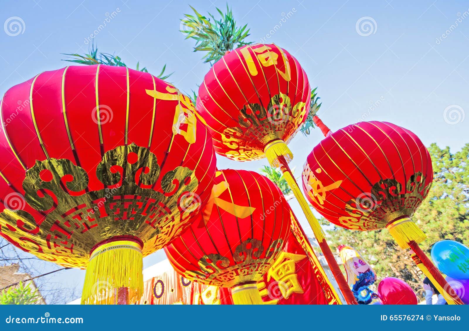 Chinese Lanterns in Red Fabric with Golden Ornaments Stock Photo