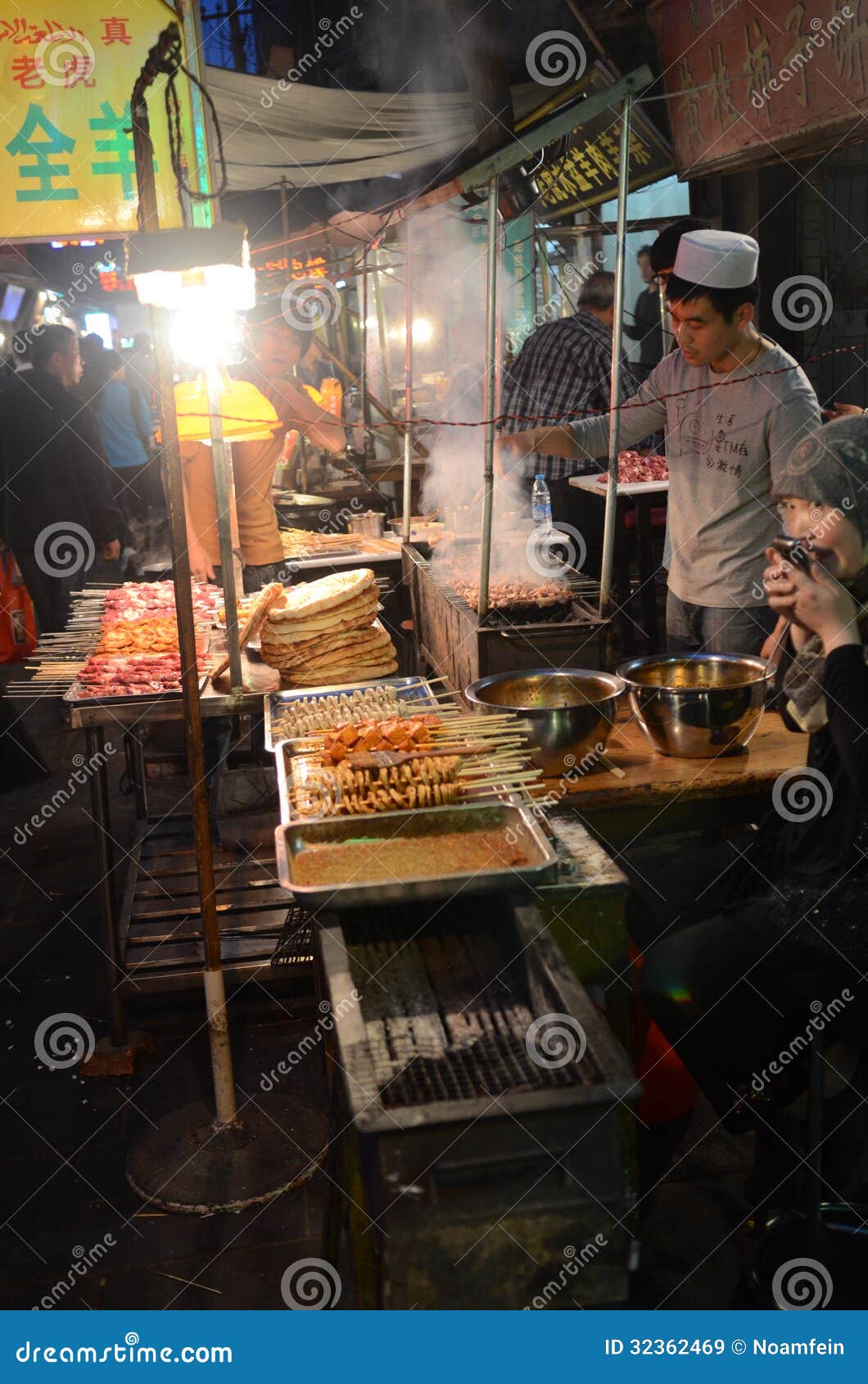 Chinese street cooking editorial stock image. Image of preparing - 32362469