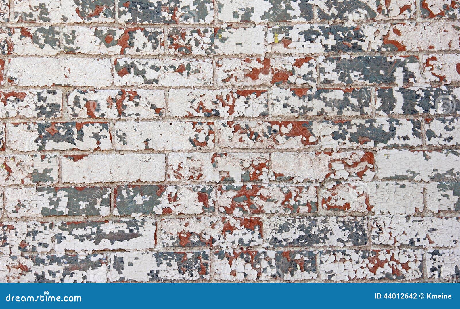 chipped red white blue paint brick wall