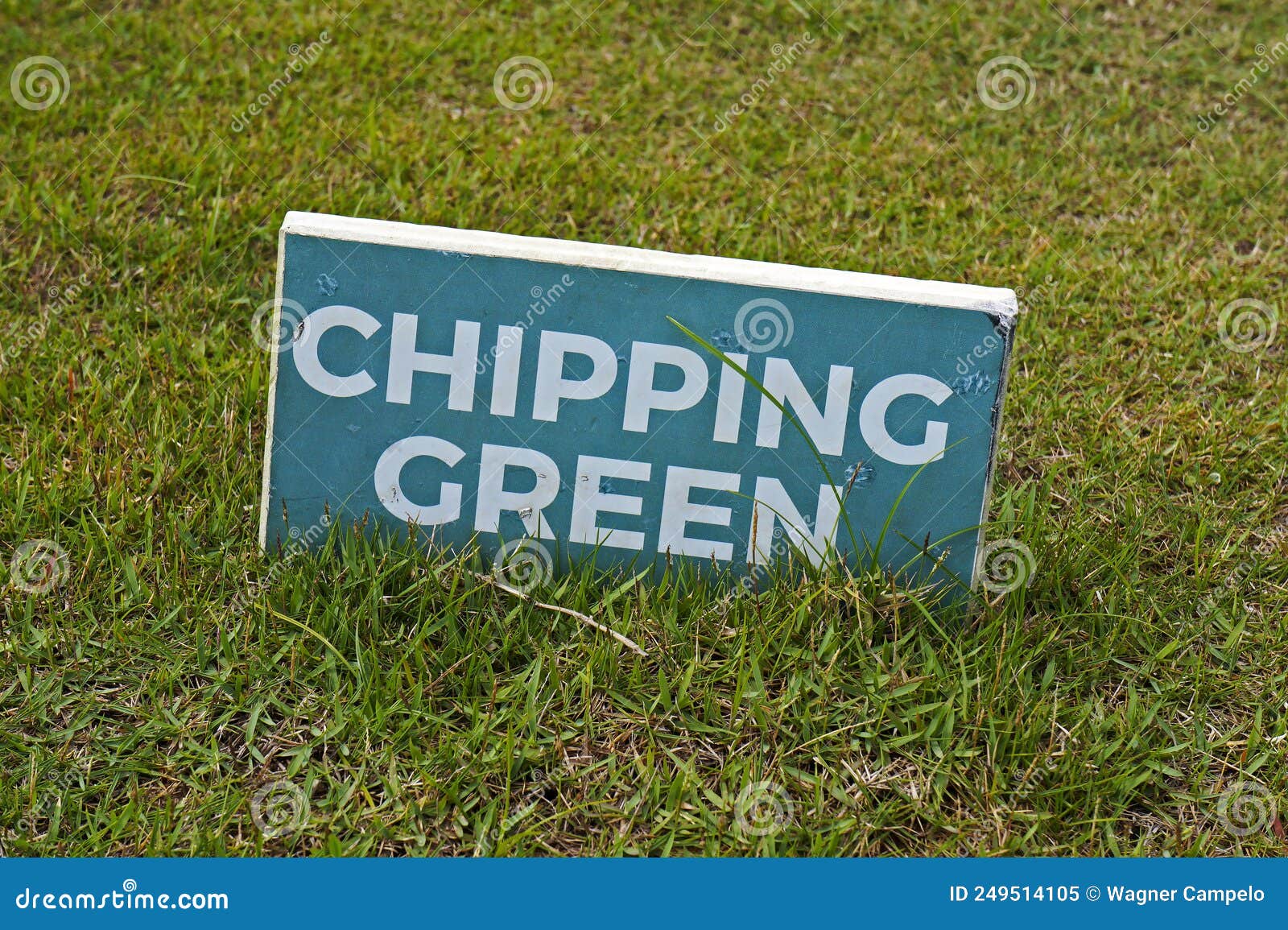 chipping green, text in a signboard over the grass on golf course, rio