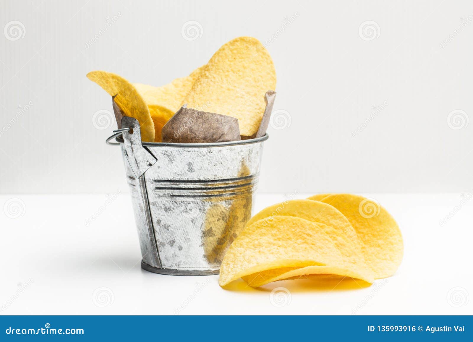 Chips in a galvanized cube stock photo. Image of pringles 135993916