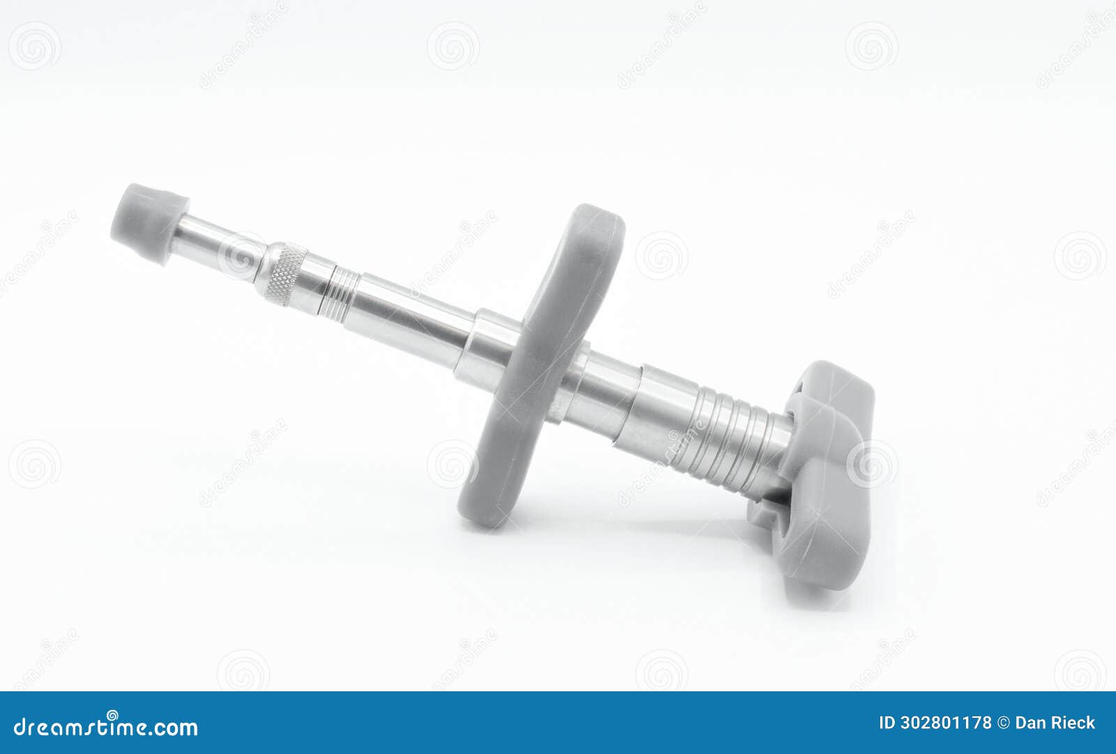 chiropractic activator 1 stainless steel tool  on white background. spine and joint manipulation adjustment tool