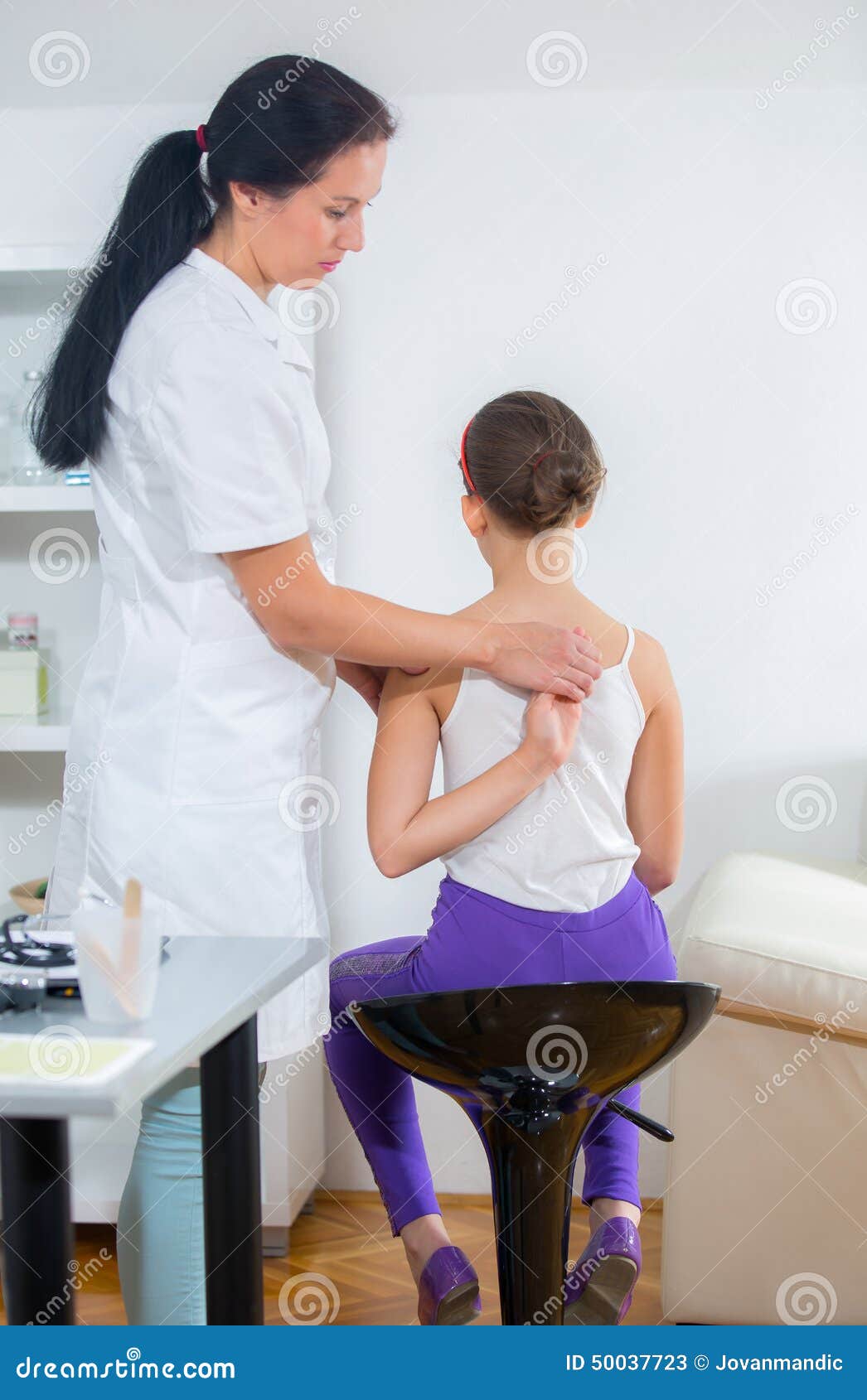 Chiropractor Doing Adjustment on Female Patient Stock Image Image of