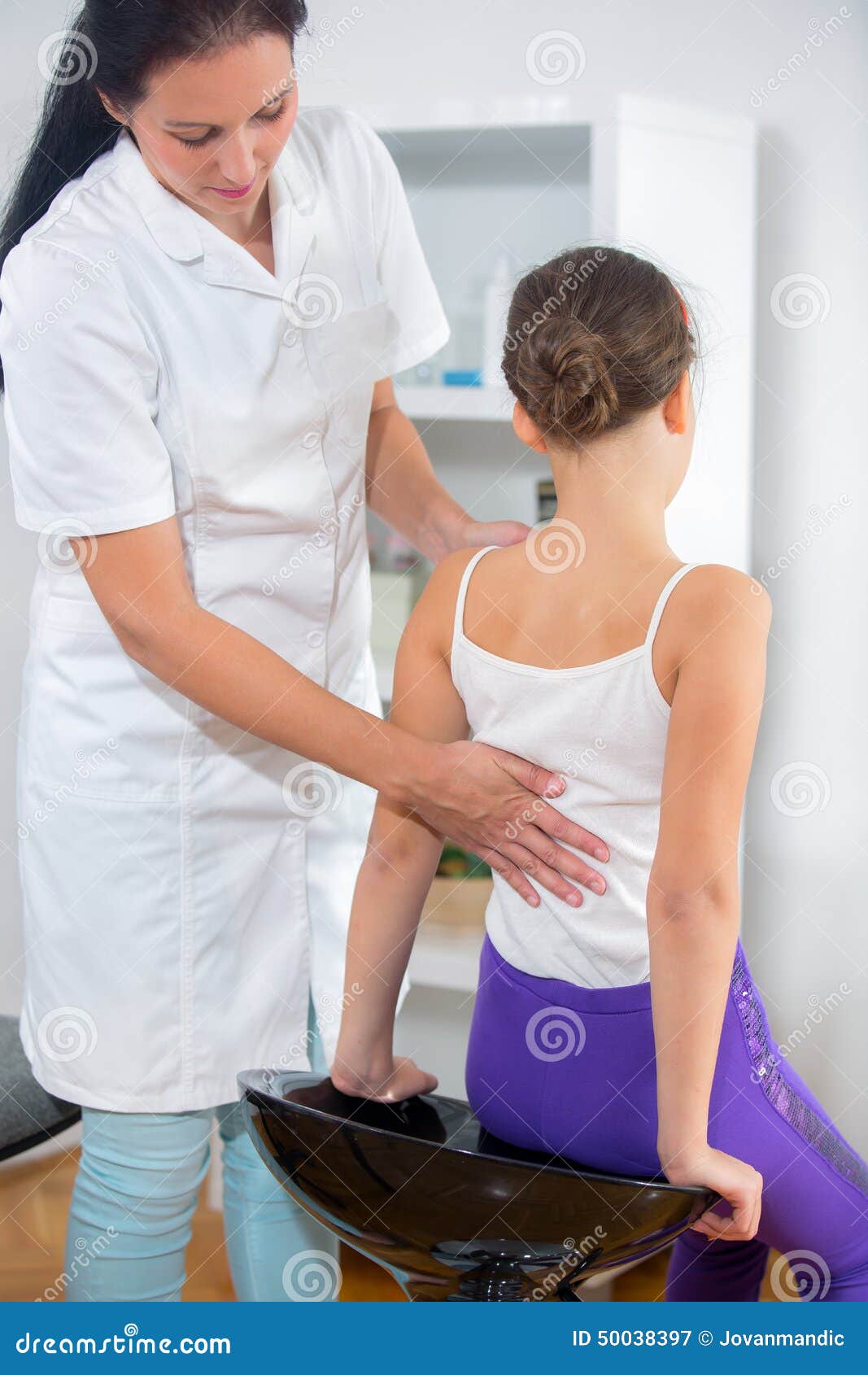 Chiropractor Doing Adjustment on Female Patient Stock Image Image of