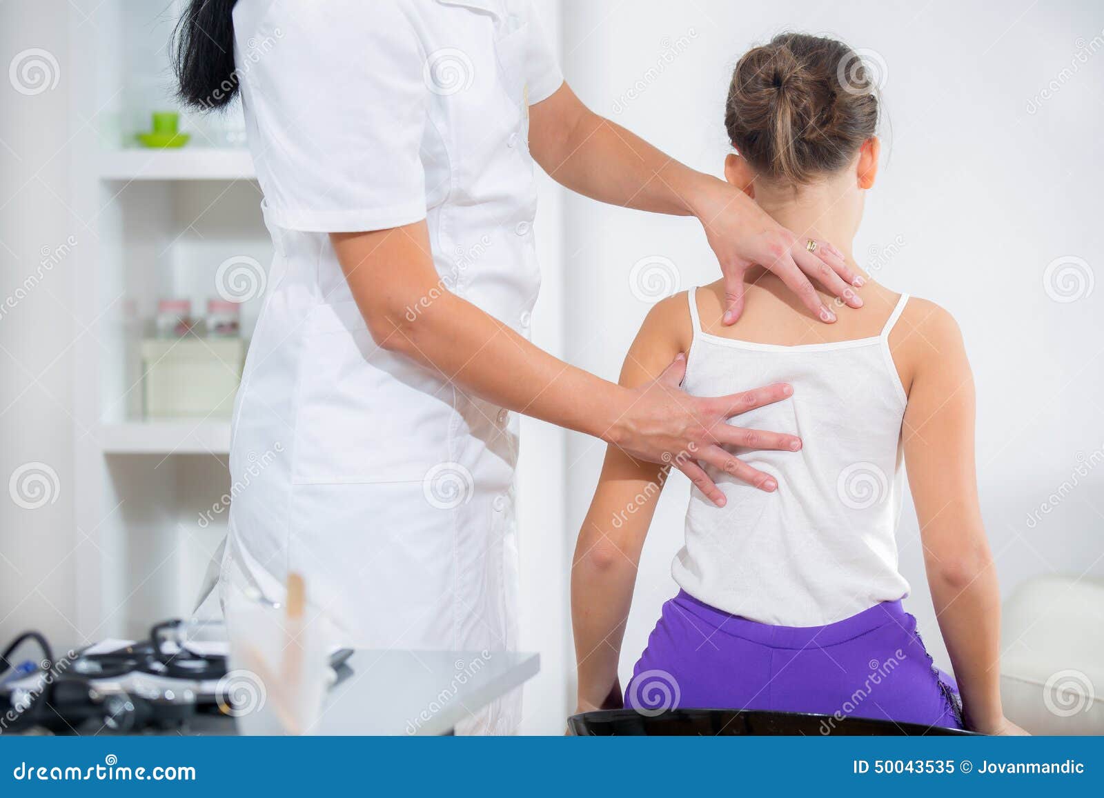 Chiropractor Doing Adjustment on Female Patient Stock Image Image of