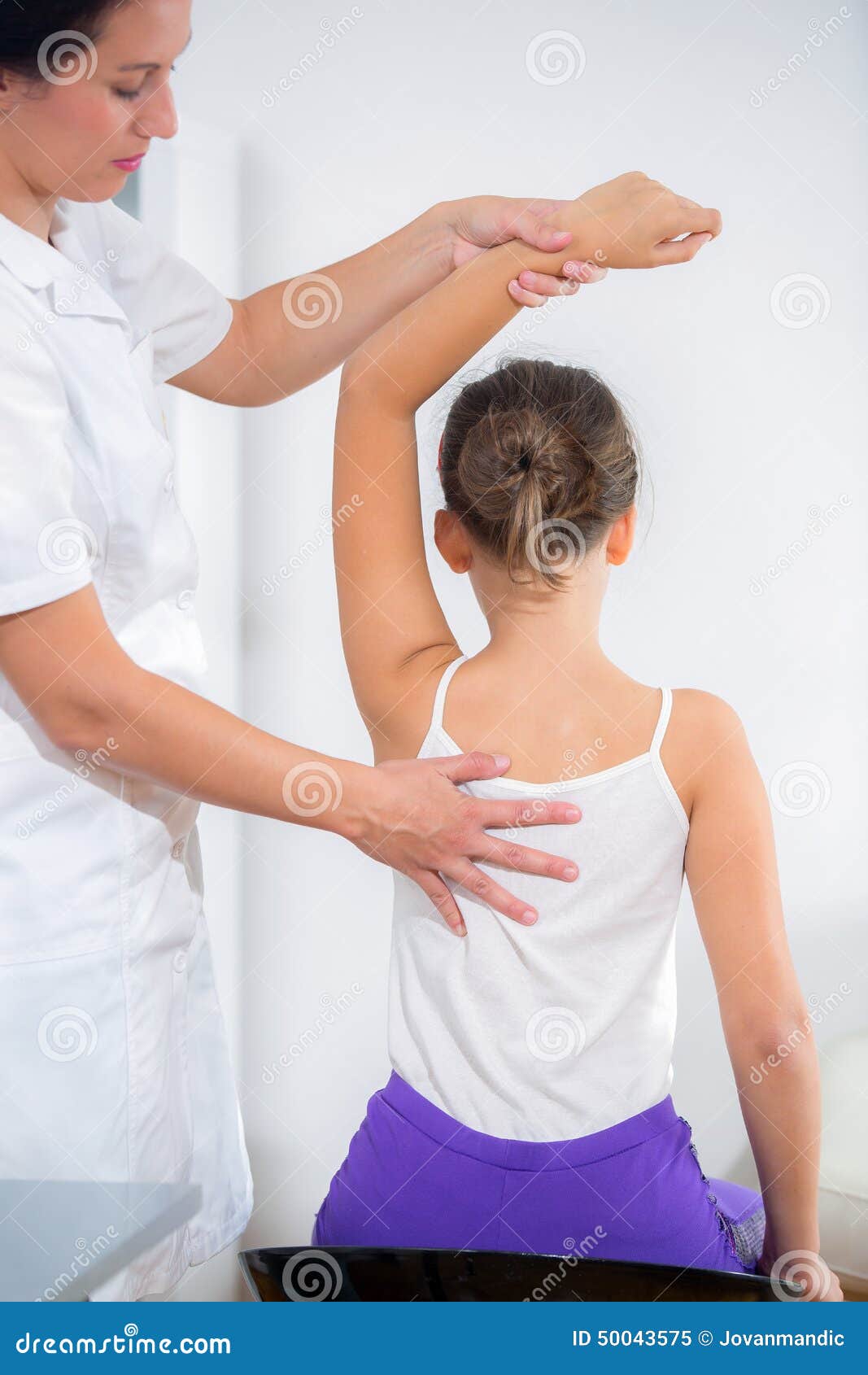 Chiropractor Doing Adjustment on Female Patient Stock Image Image of