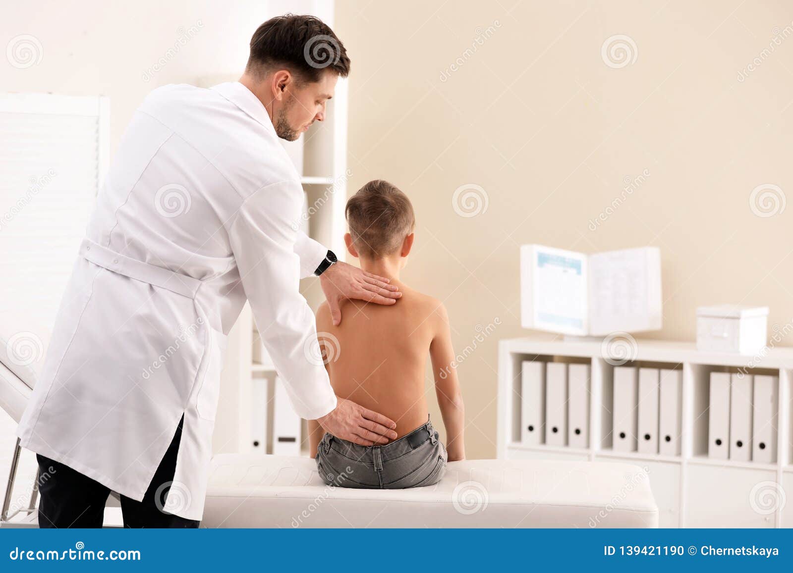 Chiropractor Examining Child with Back Pain Stock Photo Image of little, medicine 139421190