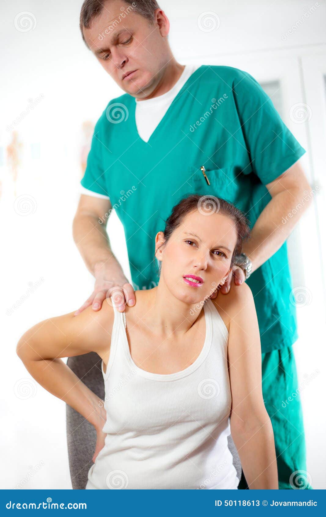 Chiropractor Massage the Female Patient Spine and Back Stock Image