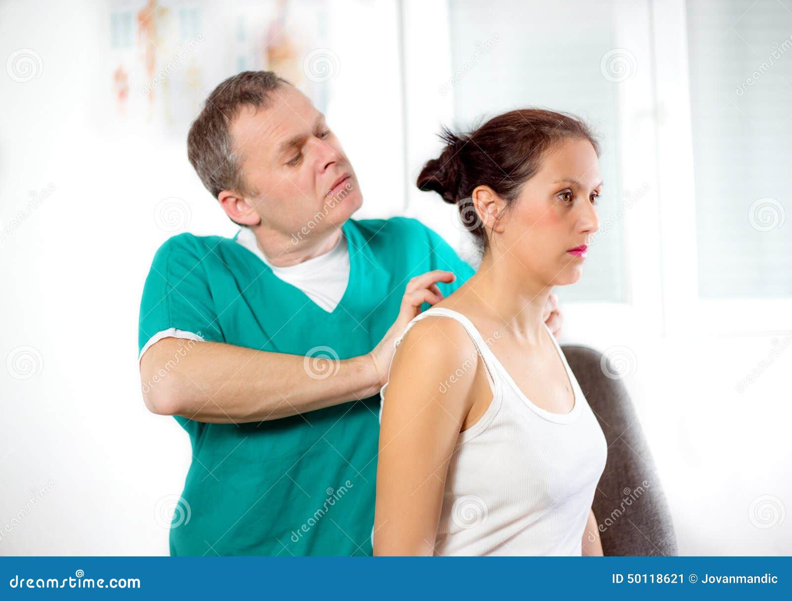 Chiropractor Massage the Female Patient Spine and Back Stock Image