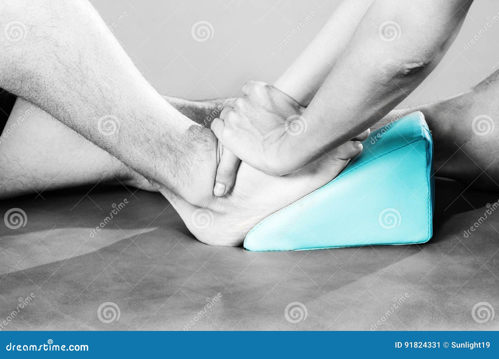 Chiropractor /physiotherapist Doing a Feet Massage in Silhouett Stock