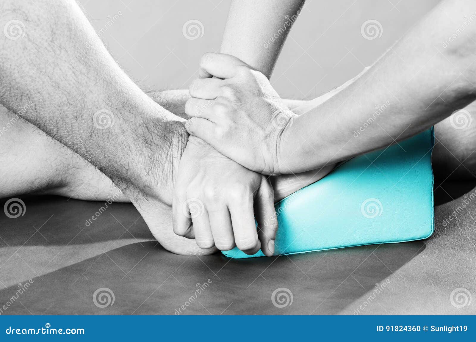 Chiropractor /physiotherapist Doing a Feet Massage in Silhouett Stock
