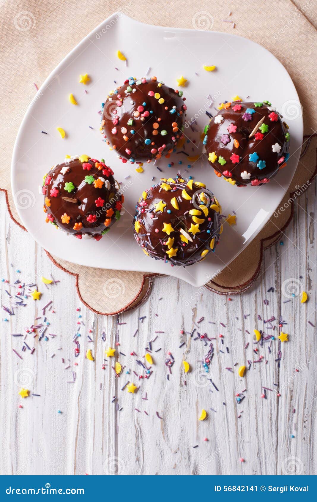 Chocolate Apples with Sprinkles Candy. Vertical Top View Stock Image