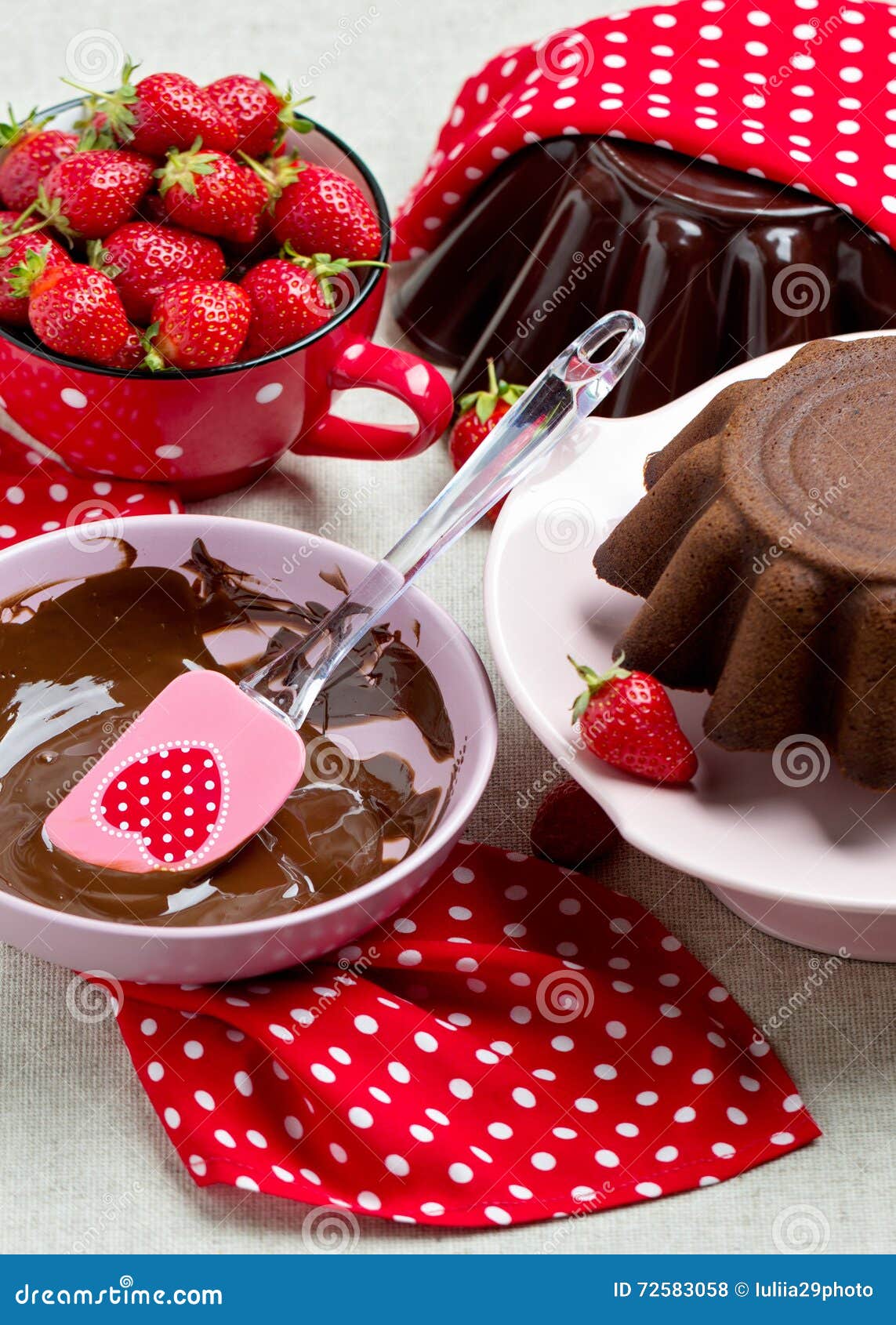 Chocolate Cake. Decorating with Chocolate Icing and Strawberries Stock